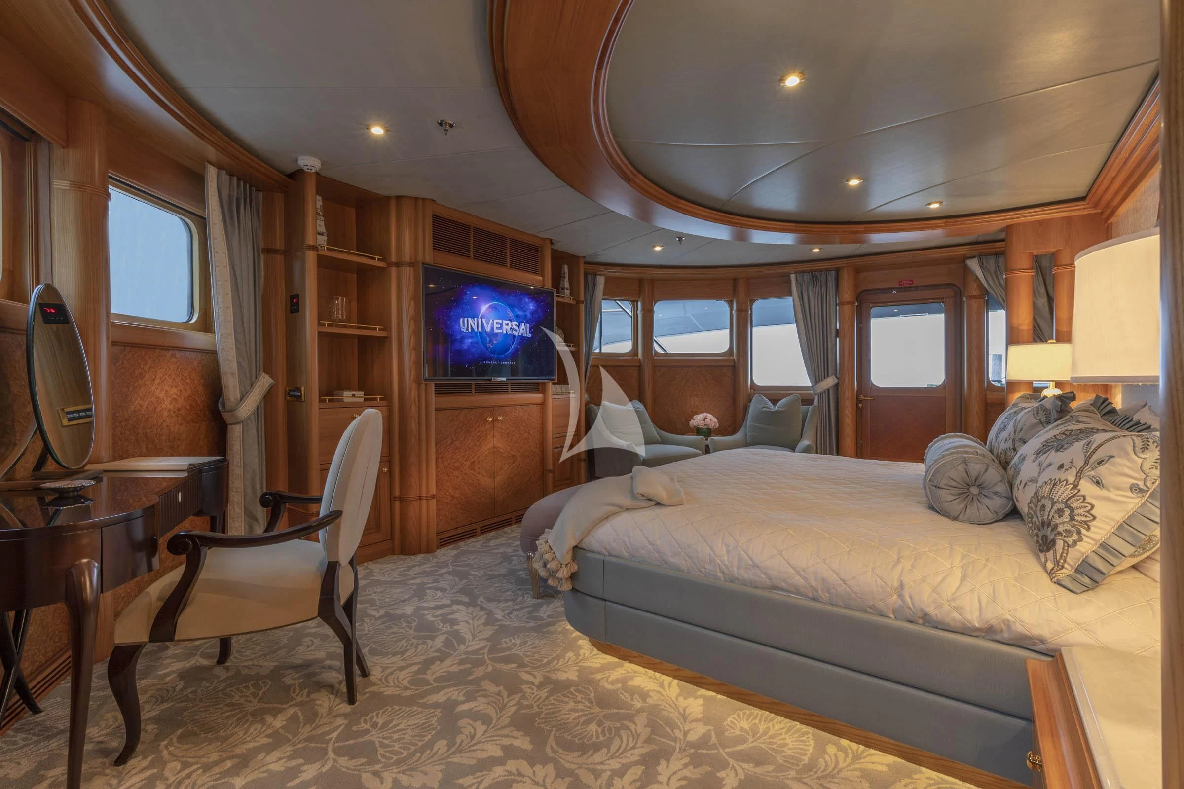 a bedroom with a bed and a tv aboard VIBRANCE Yacht for Sale