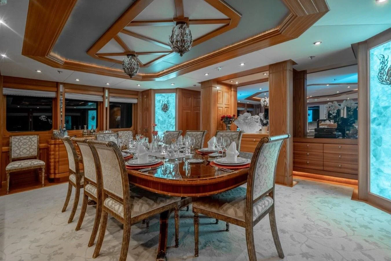 a dining room with a table and chairs aboard VIBRANCE Yacht for Sale