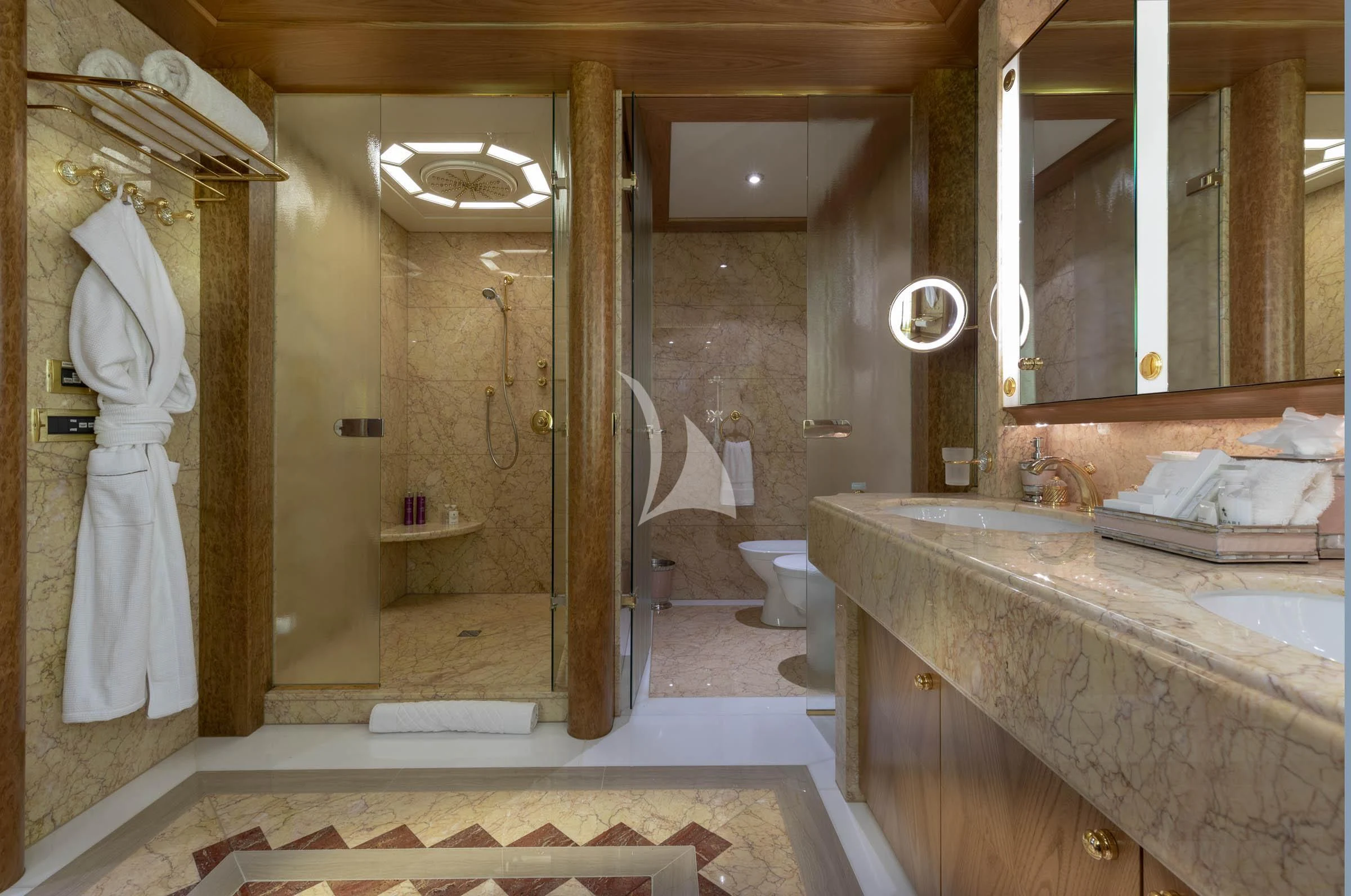 a bathroom with a marble countertop aboard VIBRANCE Yacht for Sale