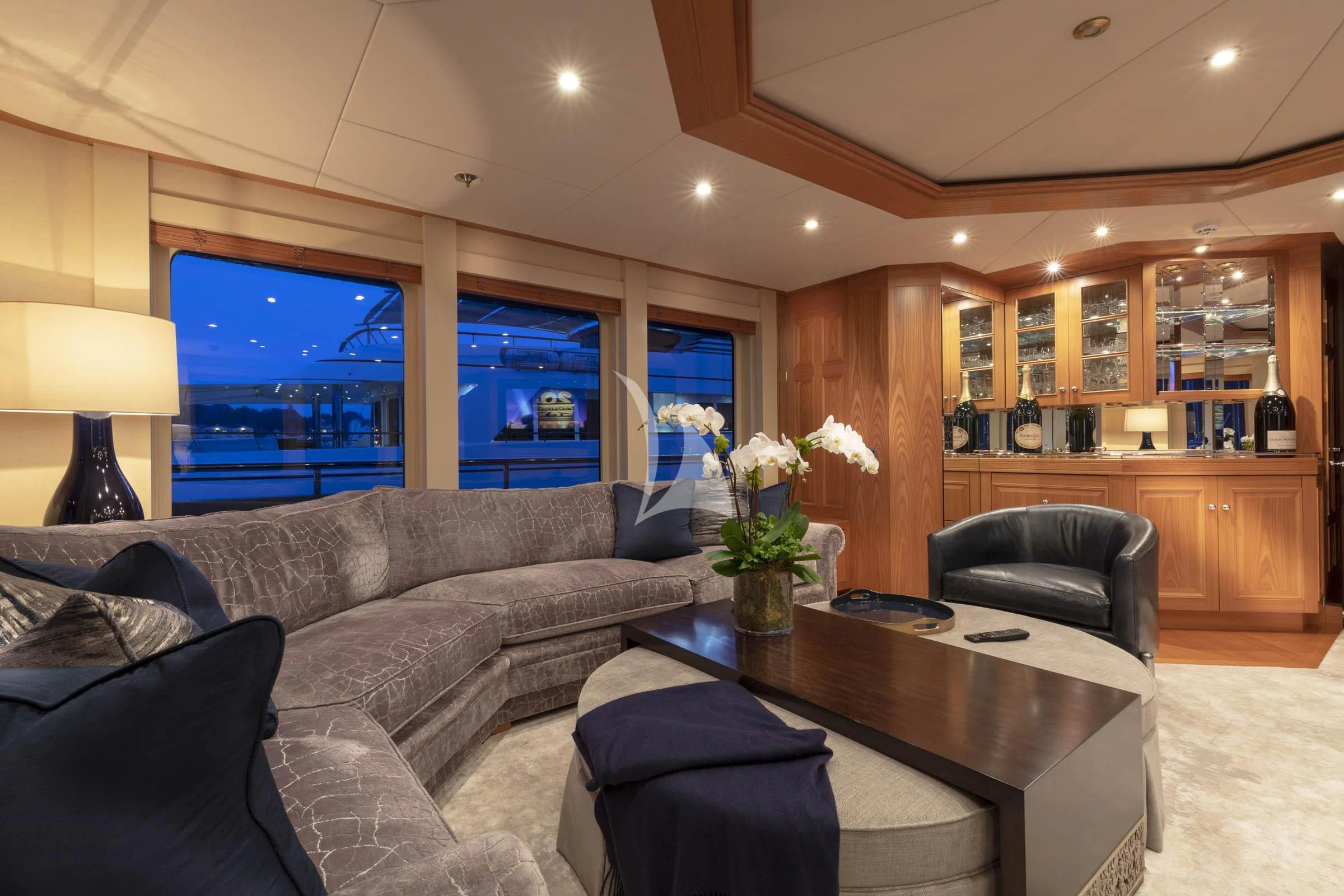 a living room with a leather couch and a tv aboard VIBRANCE Yacht for Sale