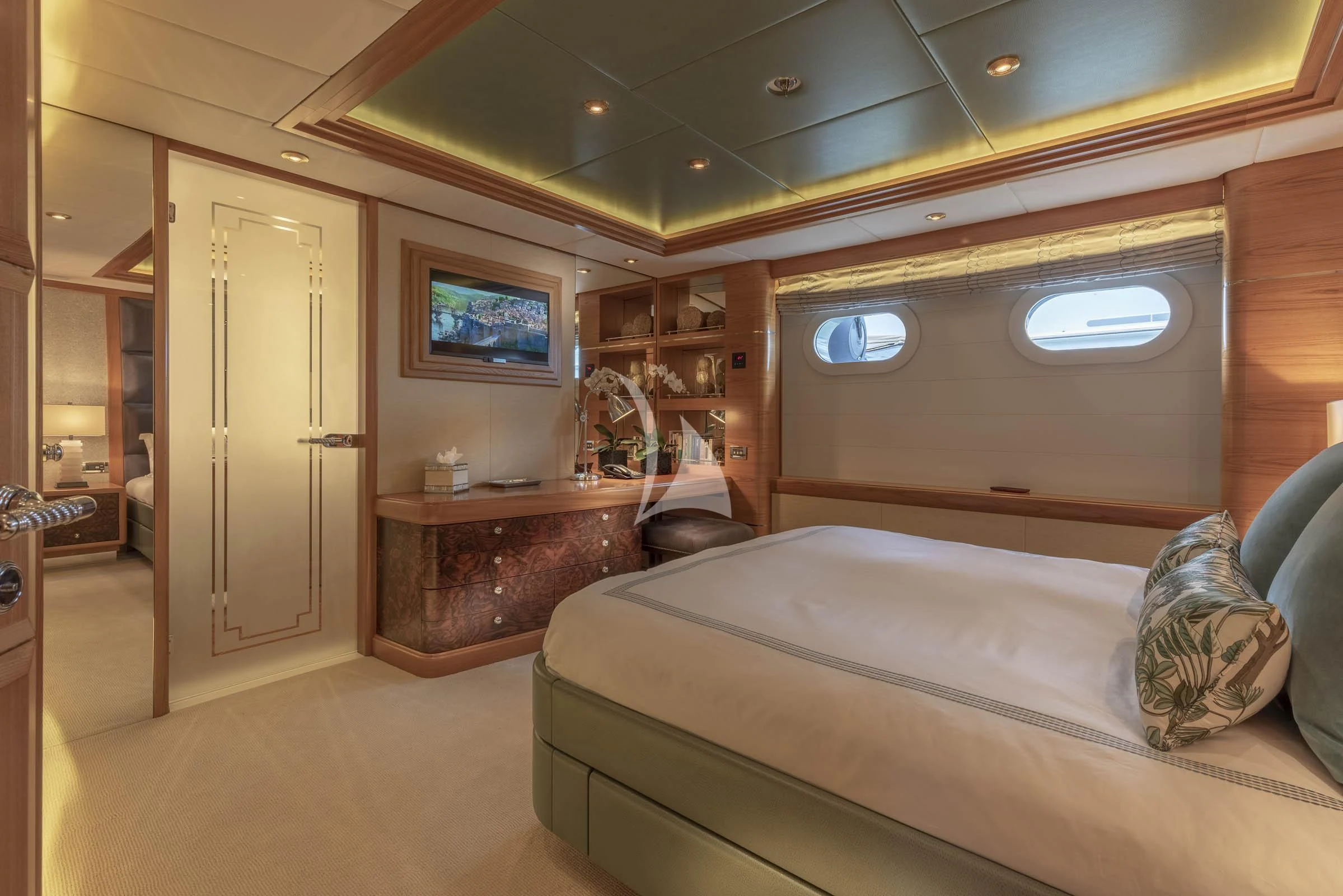 a living room with a couch and a television aboard VIBRANCE Yacht for Sale