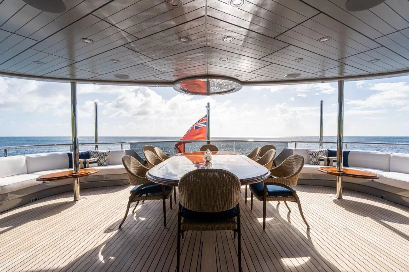 a room with a table and chairs aboard VIBRANCE Yacht for Sale