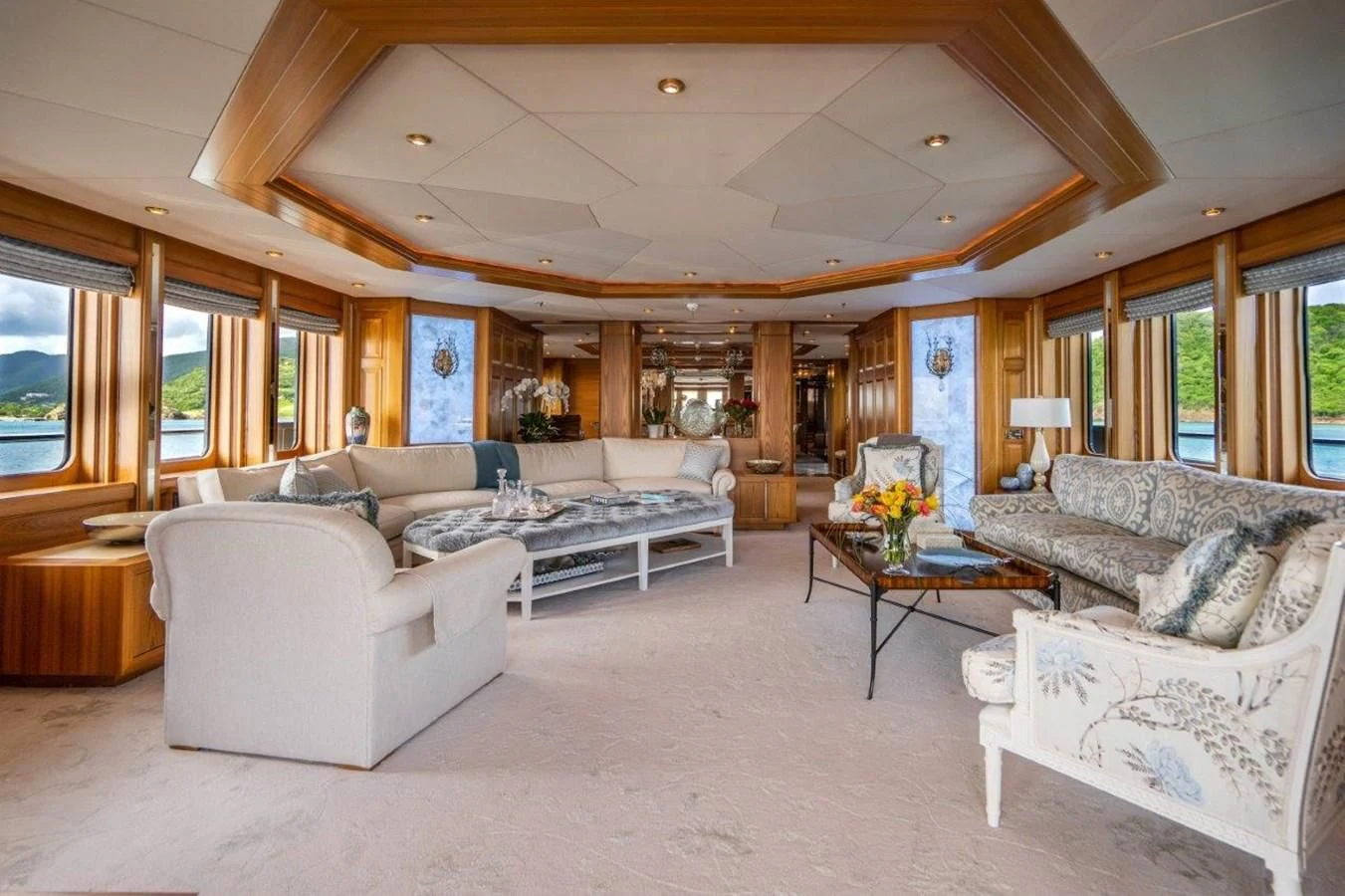 a living room with a couch and a coffee table aboard VIBRANCE Yacht for Sale