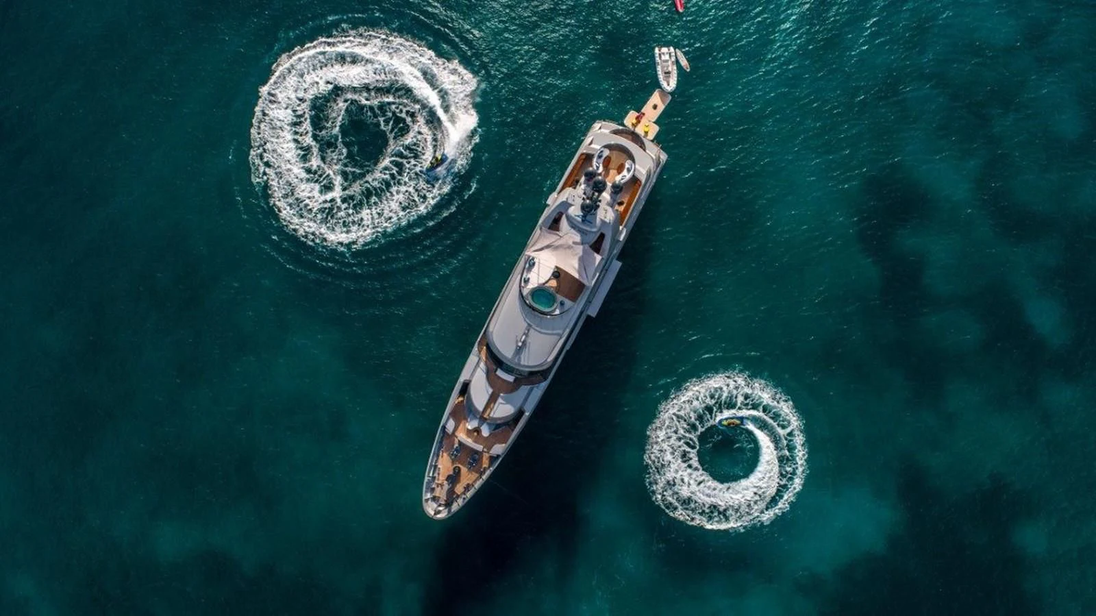 a small boat with a round white object on it aboard VIBRANCE Yacht for Sale