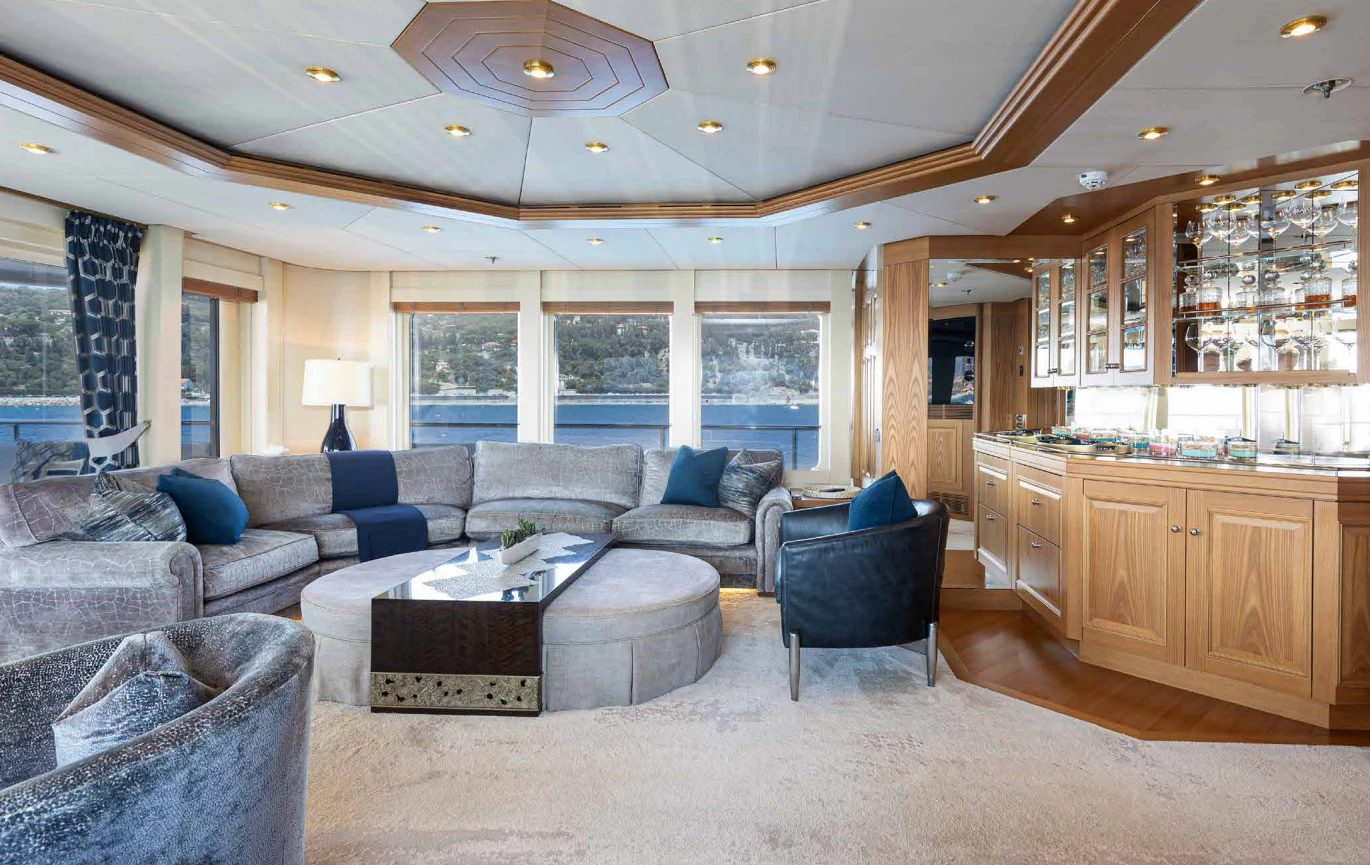 a living room with a couch and a table aboard VIBRANCE Yacht for Sale
