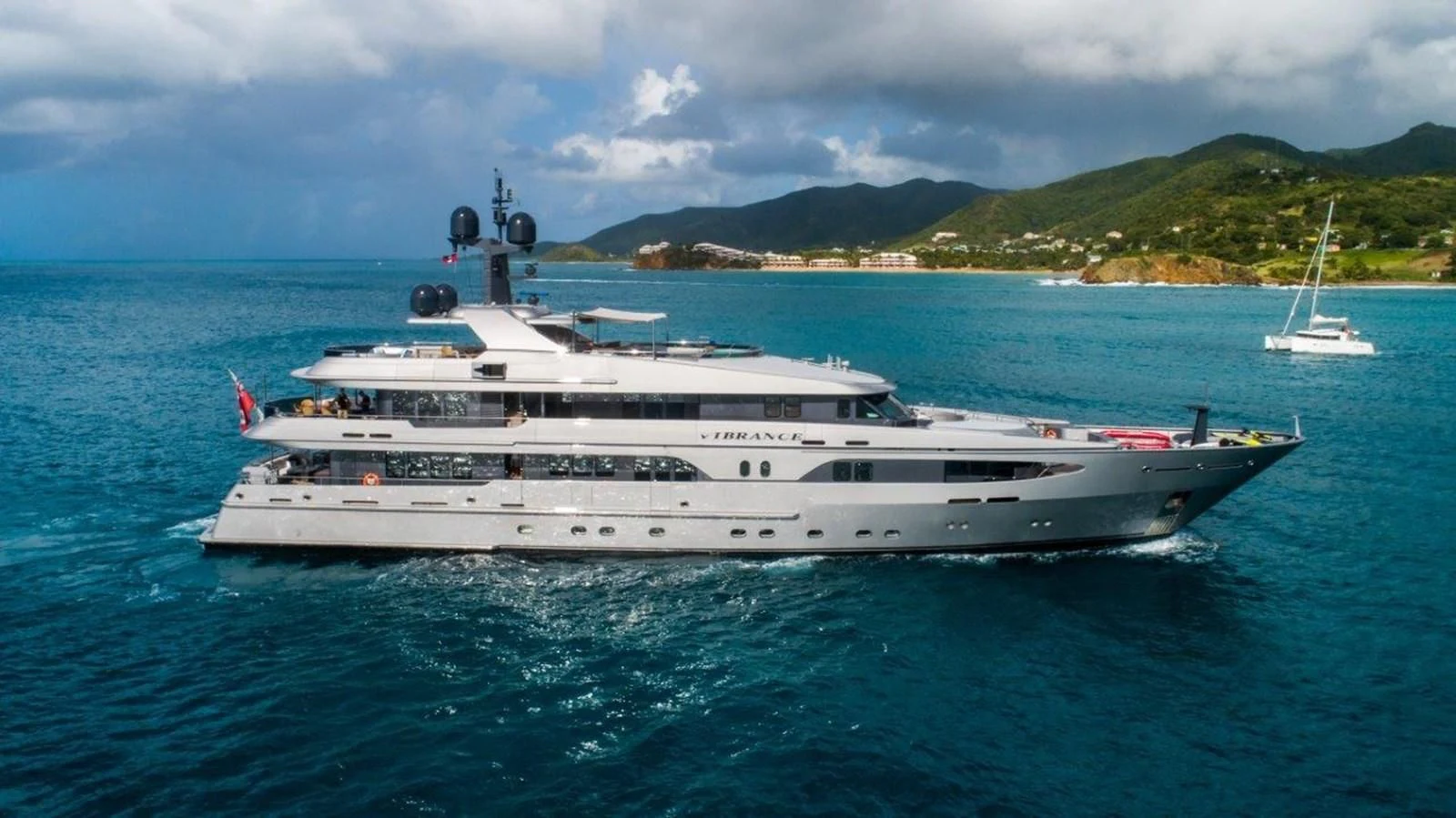 a large white yacht in the water aboard VIBRANCE Yacht for Sale