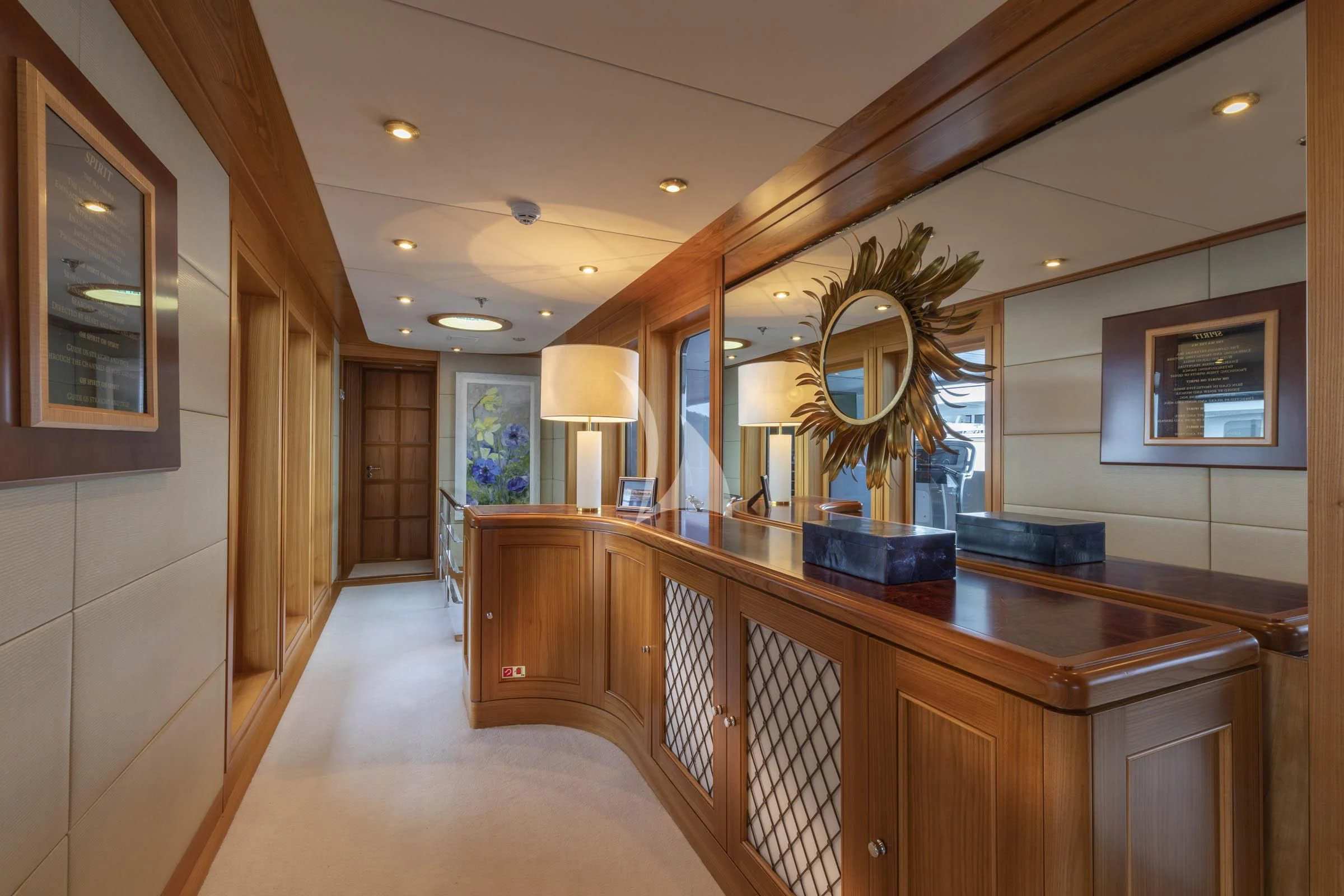 a large kitchen with wooden cabinets aboard VIBRANCE Yacht for Sale