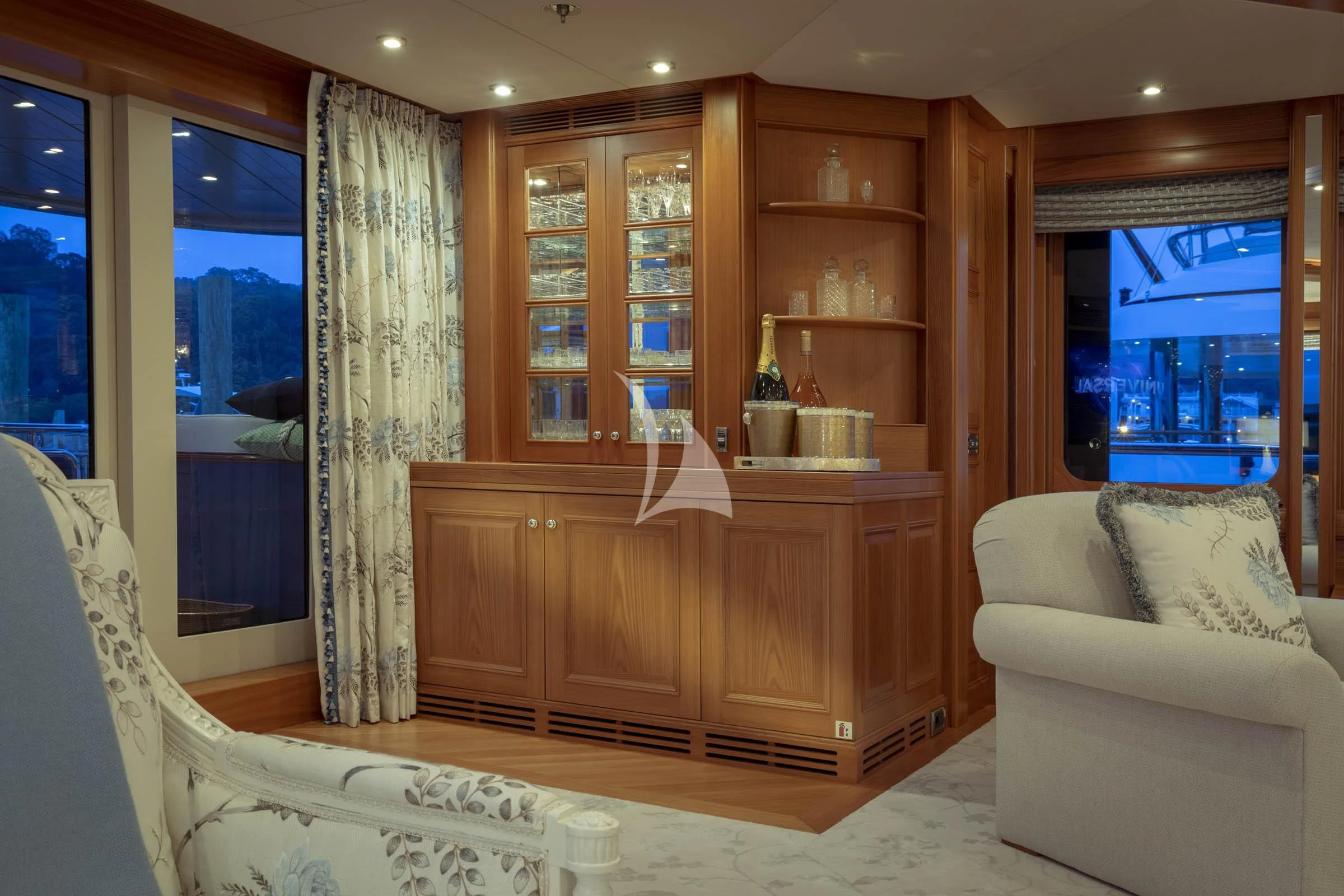 a room with a cabinet and a couch aboard VIBRANCE Yacht for Sale