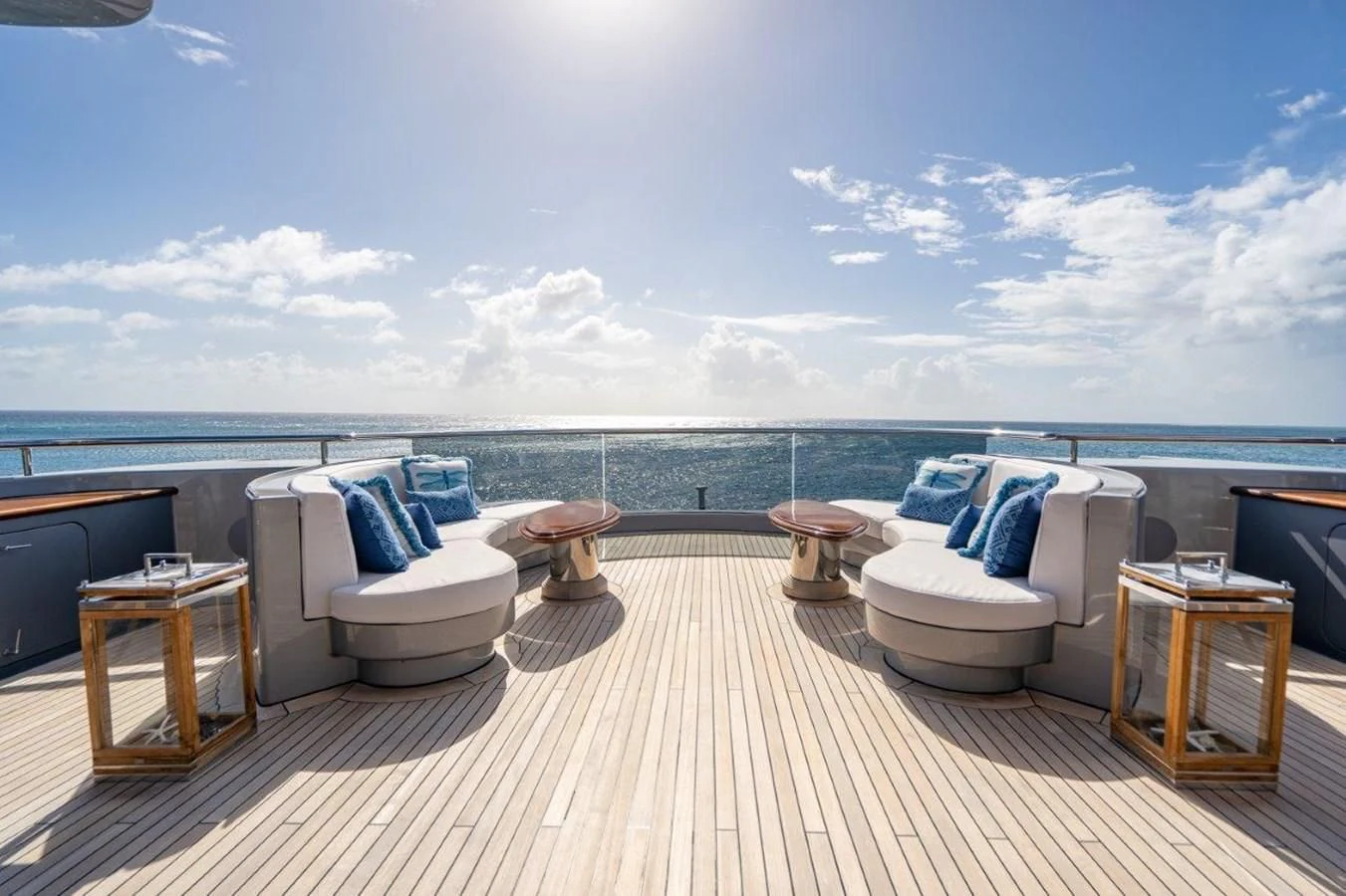 a large patio with a large body of water and a large deck aboard VIBRANCE Yacht for Sale