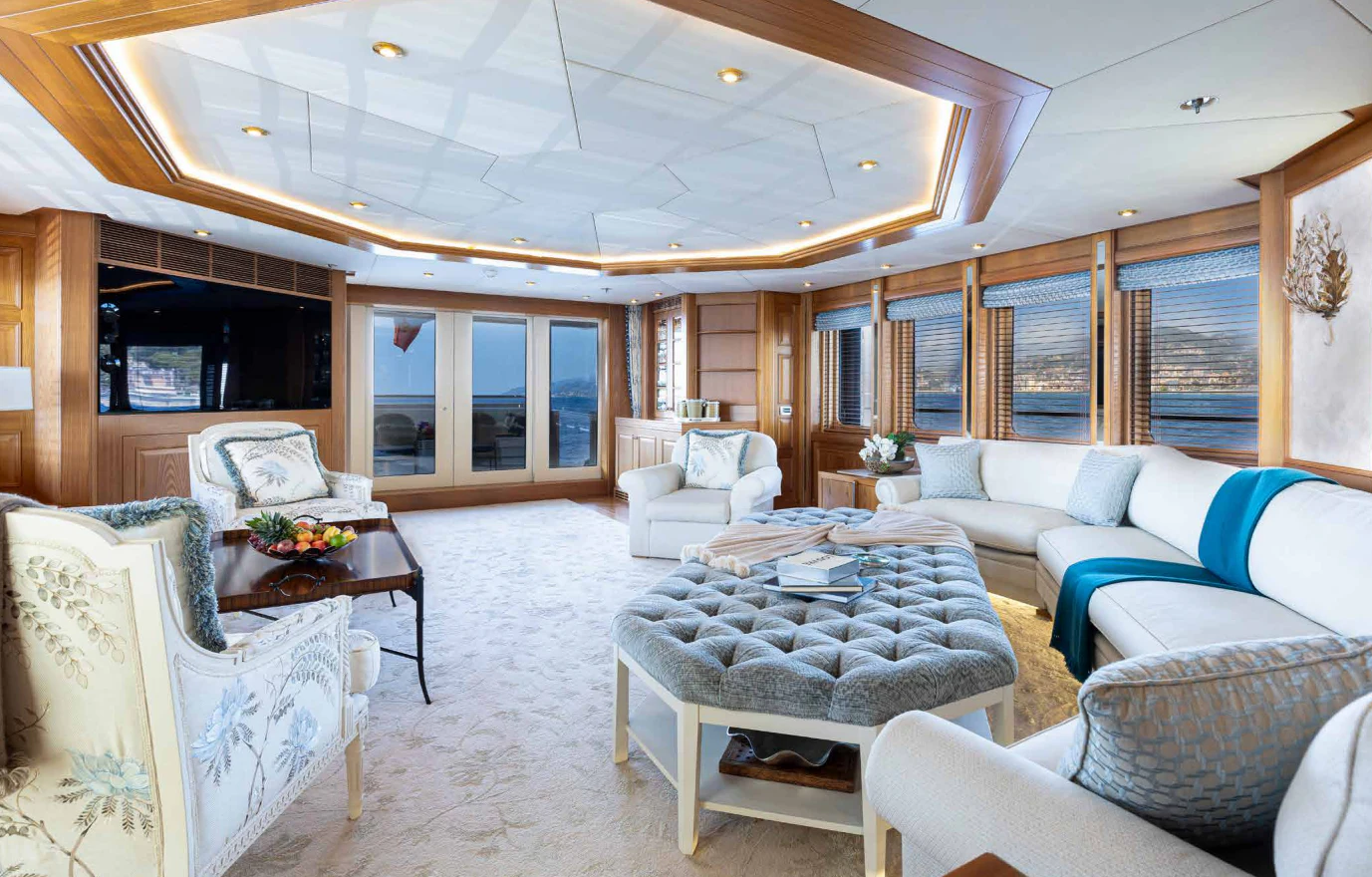 a living room with a large open ceiling aboard VIBRANCE Yacht for Sale