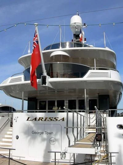 a large white ship with flags on it aboard VIBRANCE Yacht for Sale