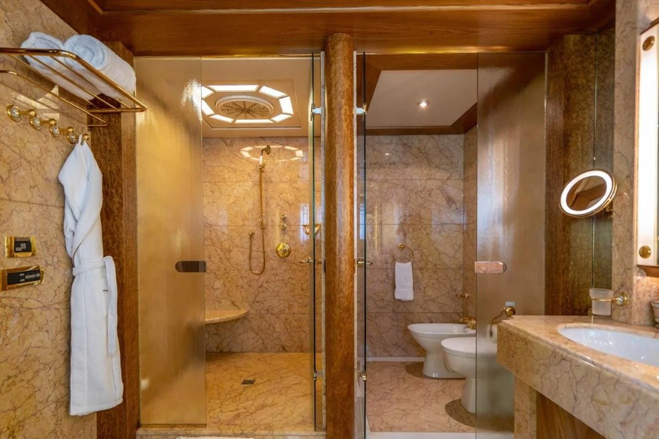 a bathroom with a glass shower aboard VIBRANCE Yacht for Sale