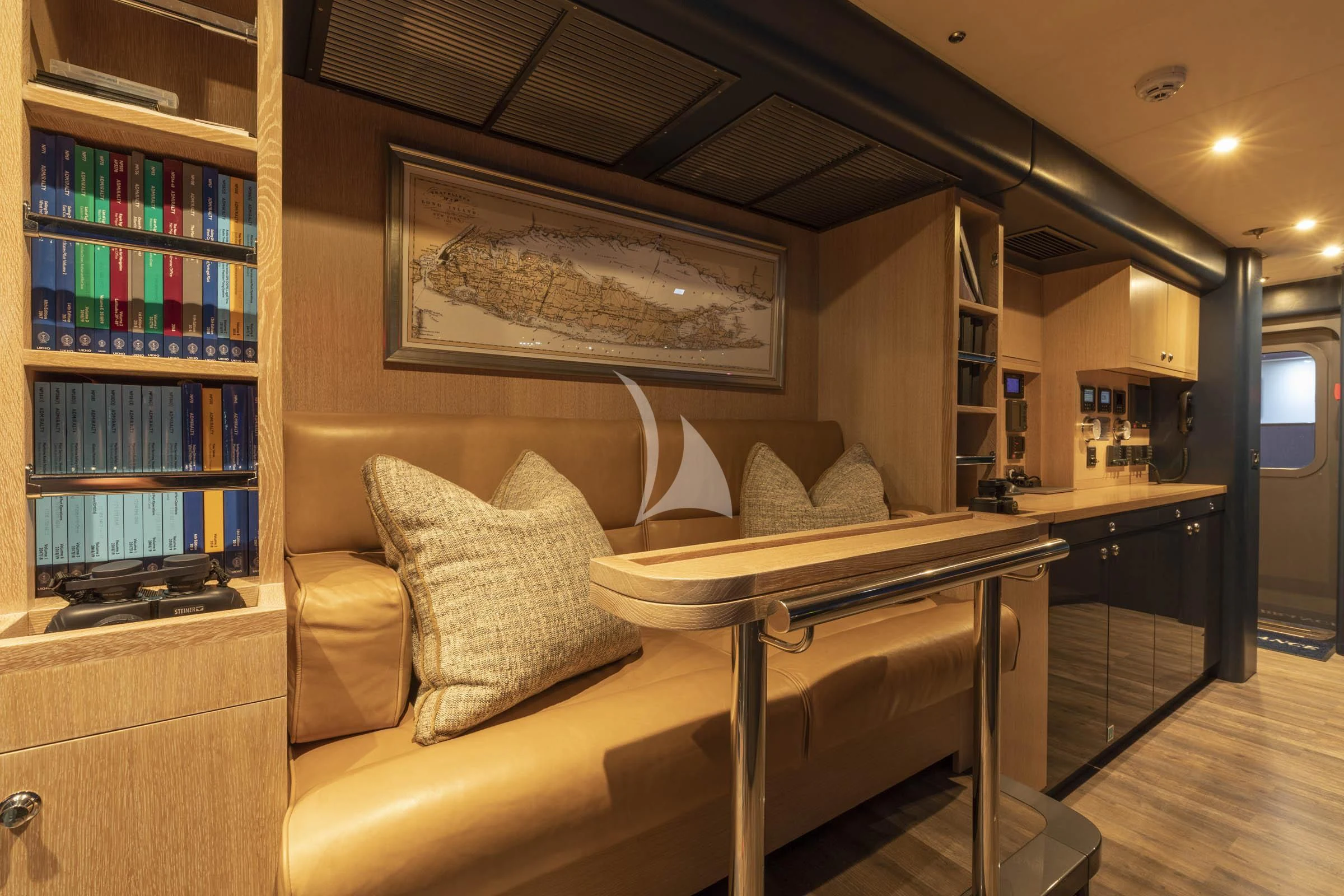 a living room with a couch and a table aboard VIBRANCE Yacht for Sale