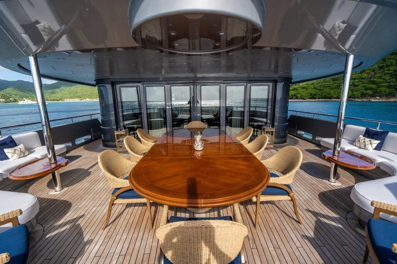 a table with chairs around it aboard VIBRANCE Yacht for Sale
