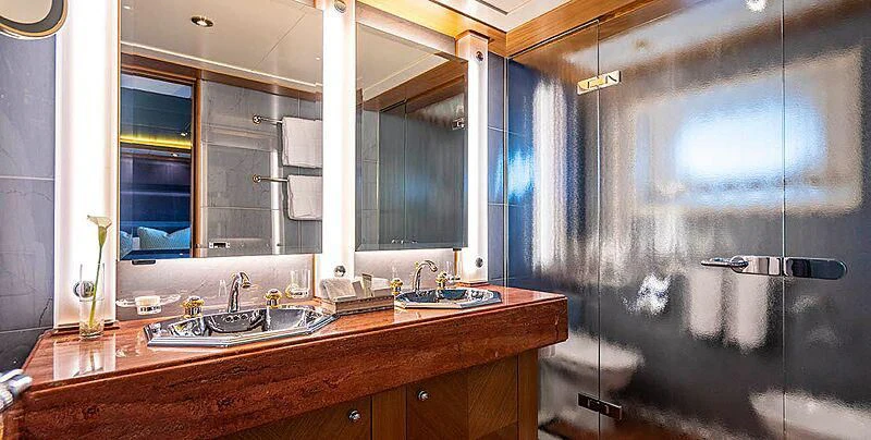 a bathroom with a large glass shower aboard VIBRANCE Yacht for Sale