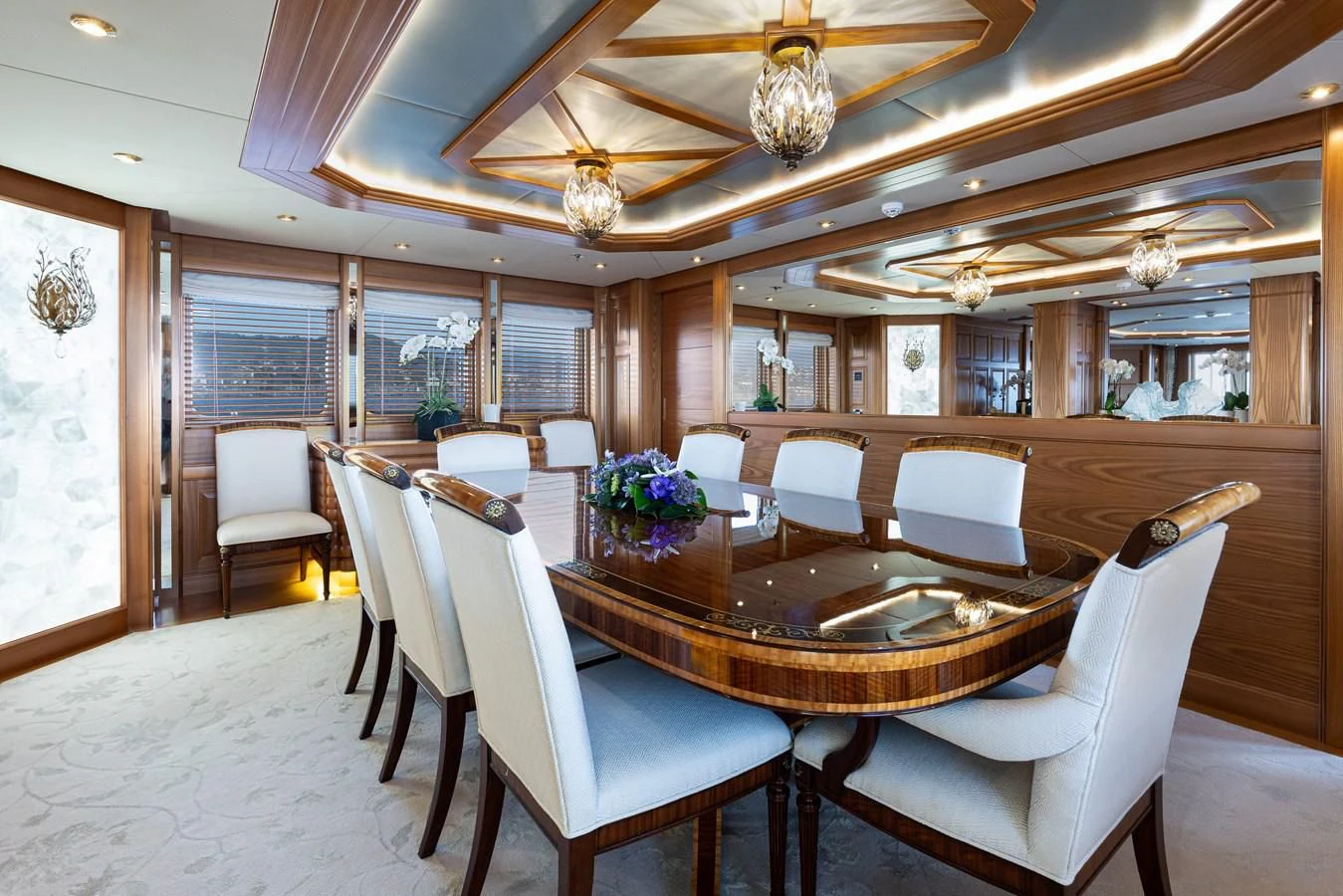 a dining room with a table and chairs aboard VIBRANCE Yacht for Sale