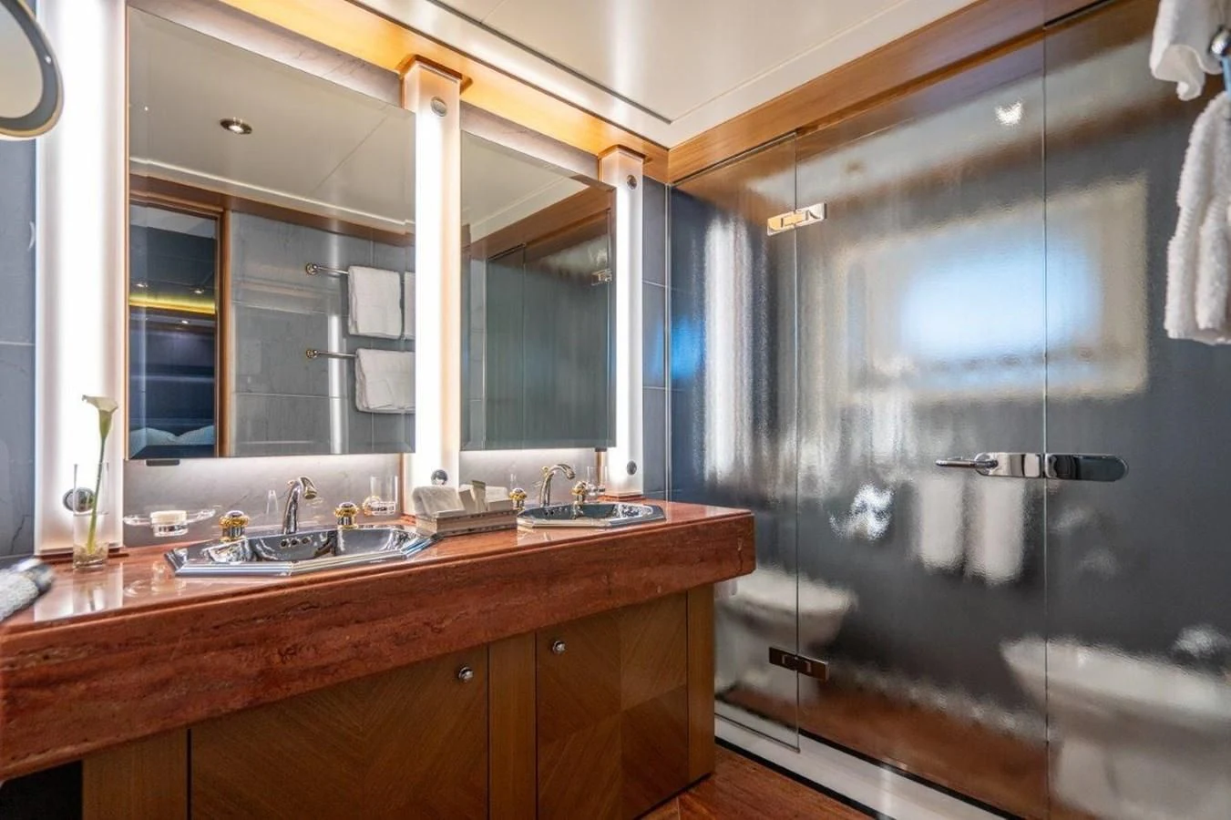 a bathroom with a large mirror aboard VIBRANCE Yacht for Sale