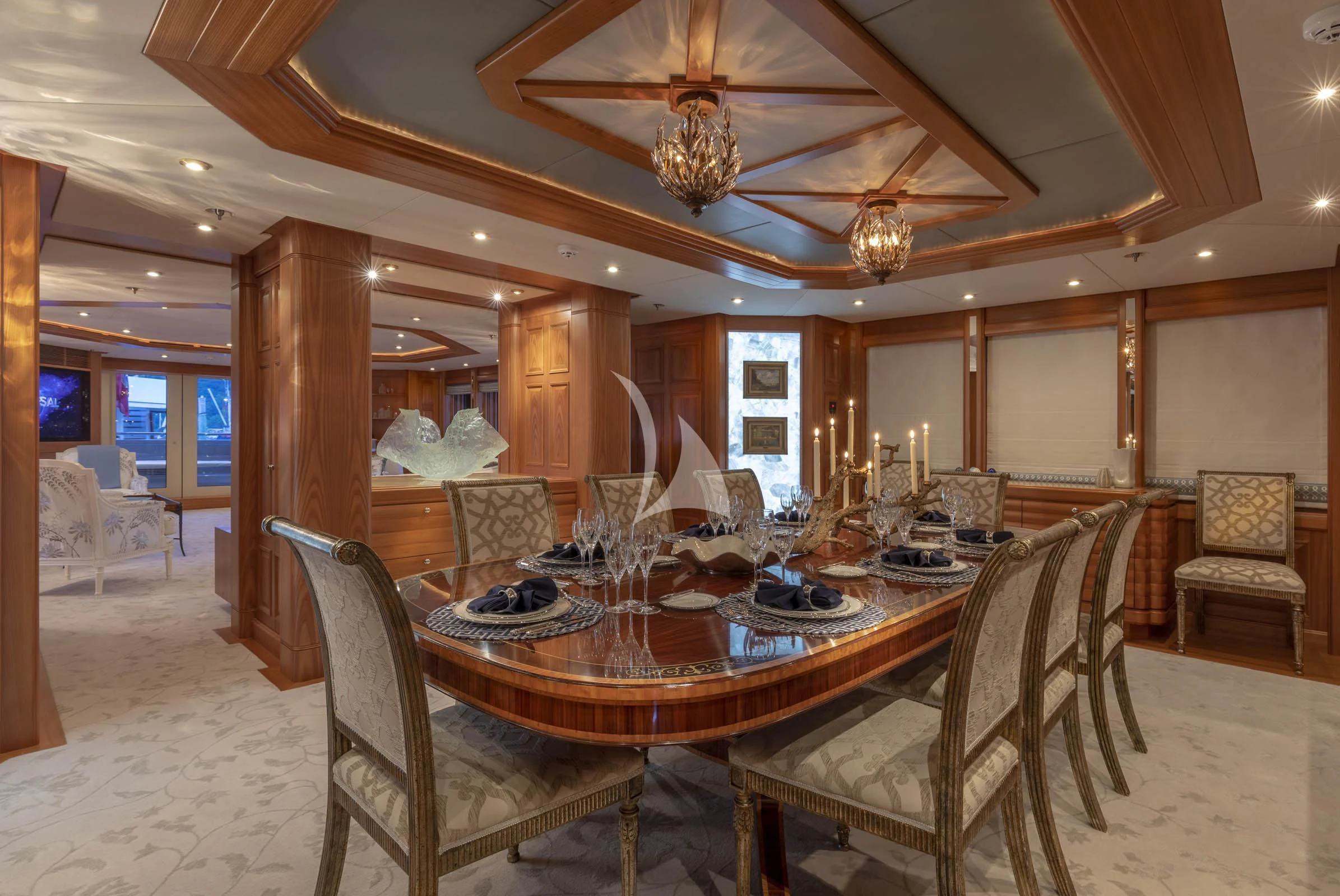 a large dining room with a large table and chairs aboard VIBRANCE Yacht for Sale