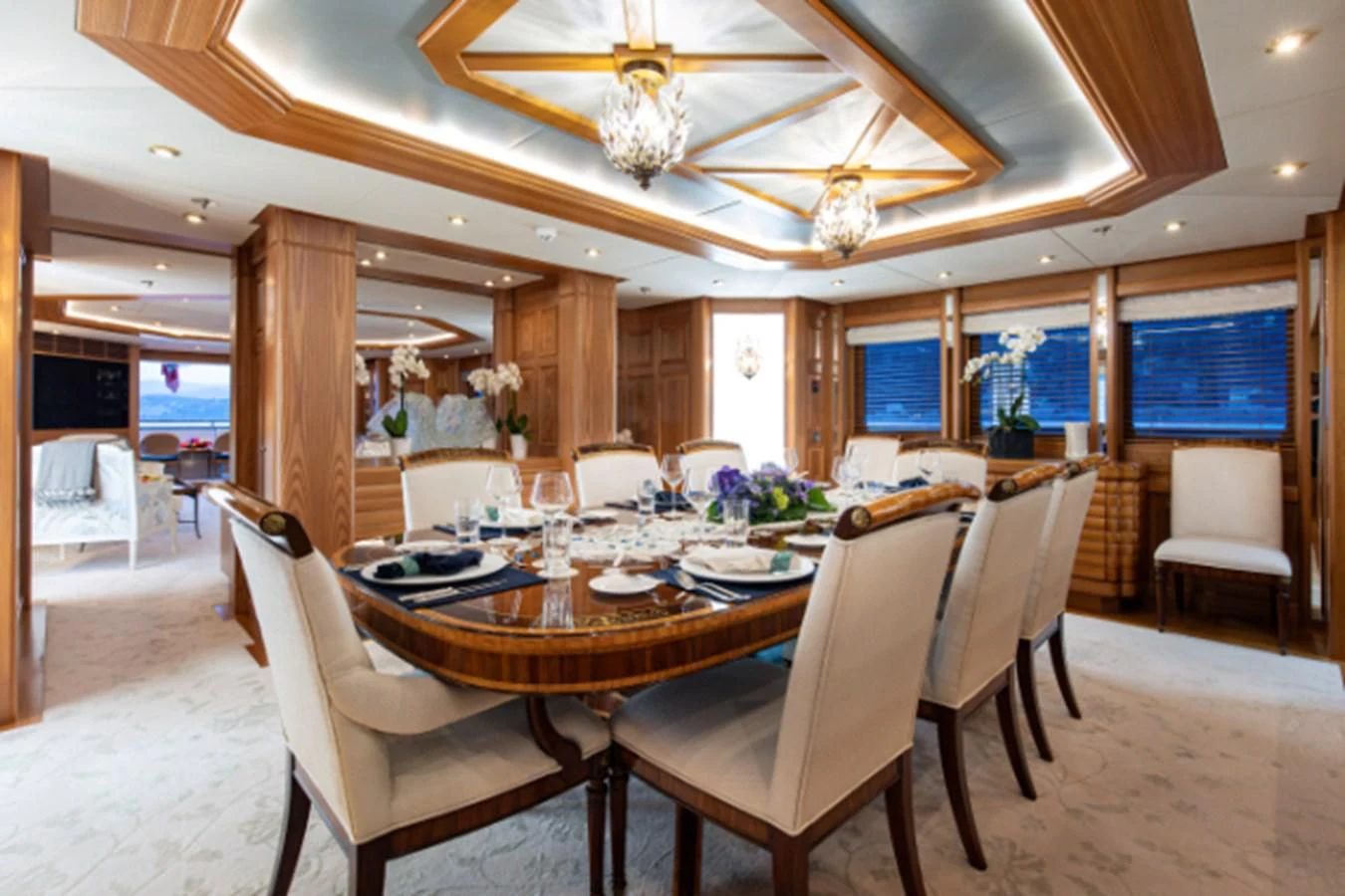 a dining room with a table and chairs aboard VIBRANCE Yacht for Sale