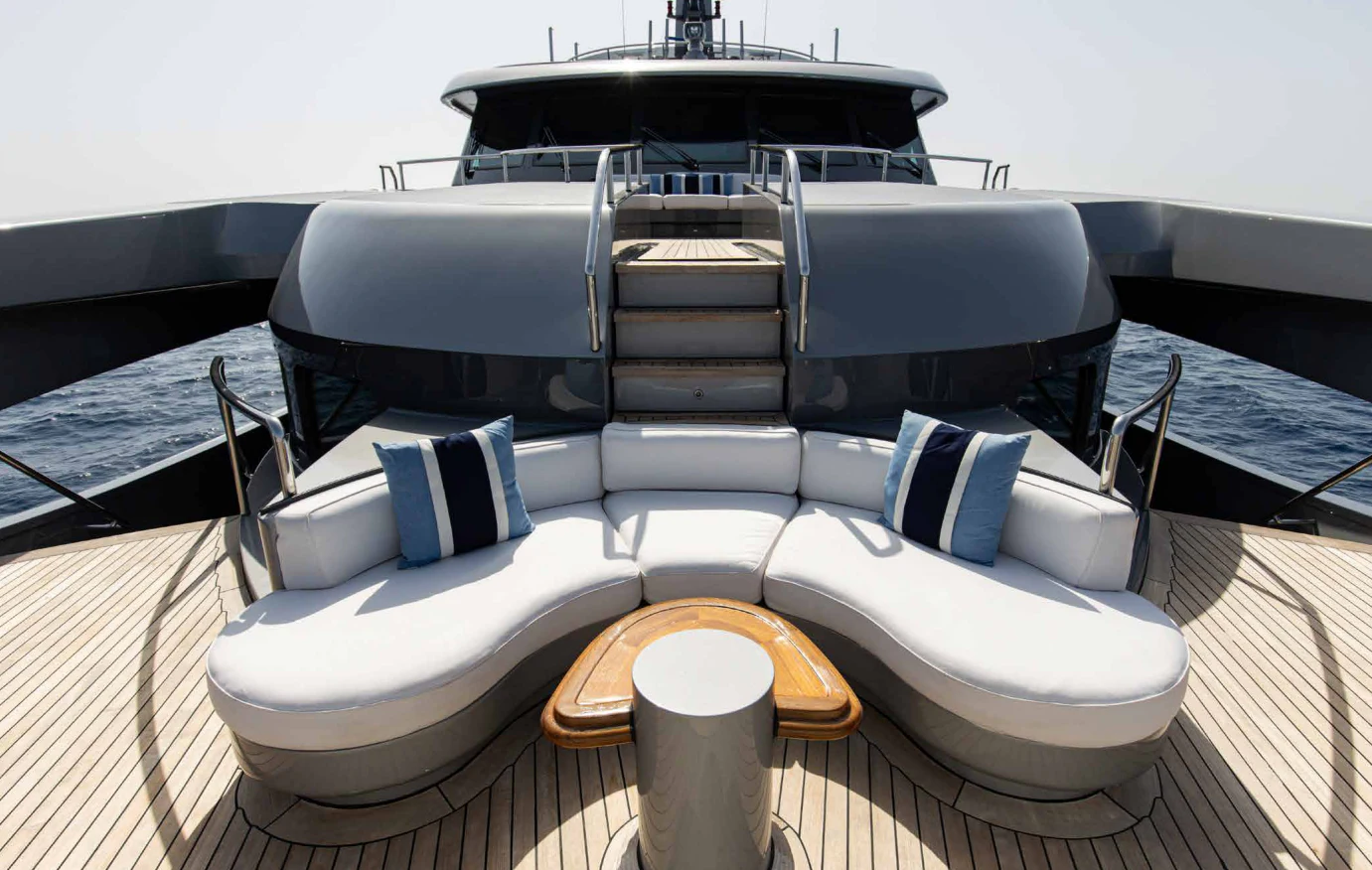 a luxury yacht with a table aboard VIBRANCE Yacht for Sale