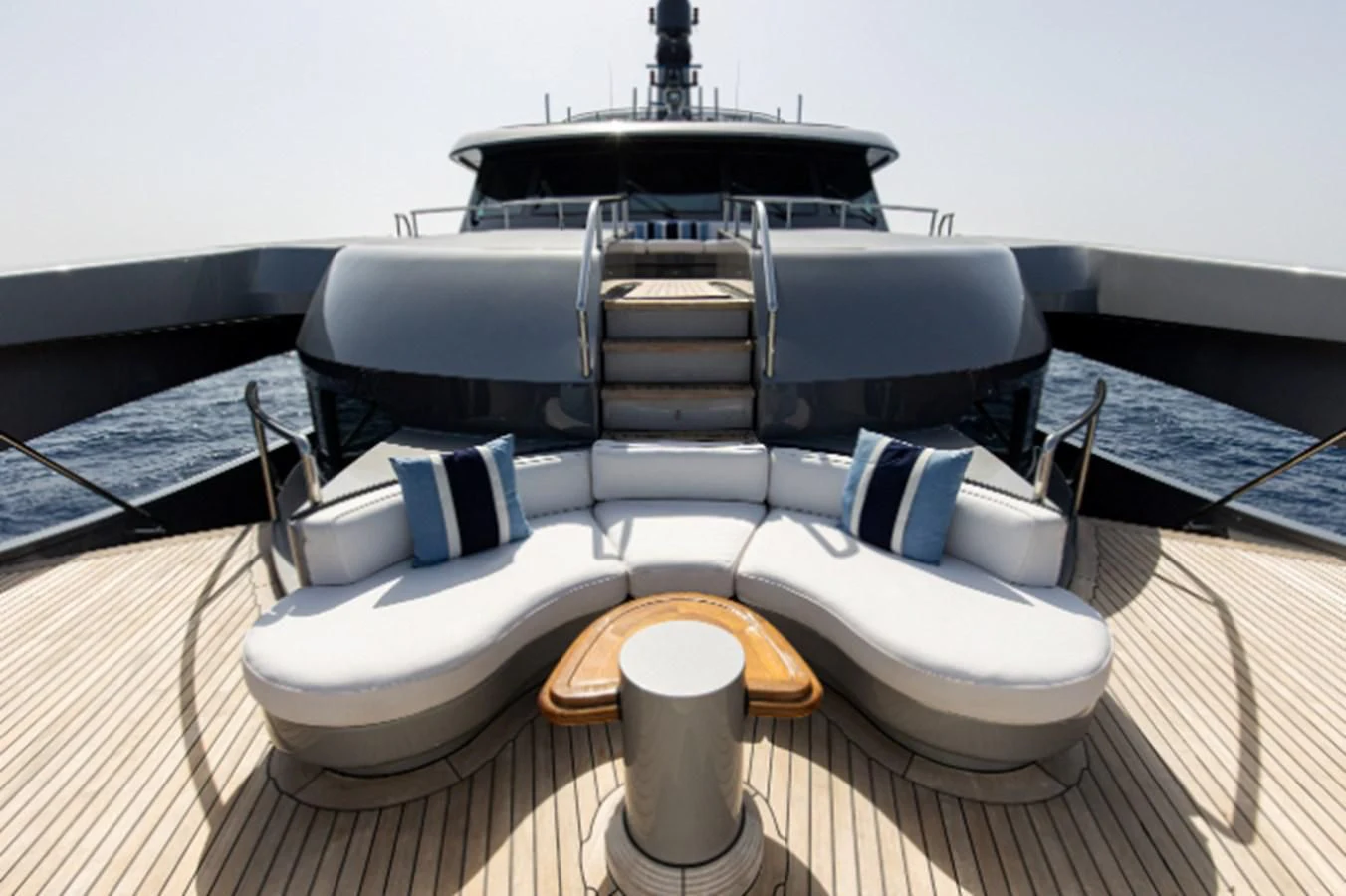 a white boat with a wooden steering wheel aboard VIBRANCE Yacht for Sale