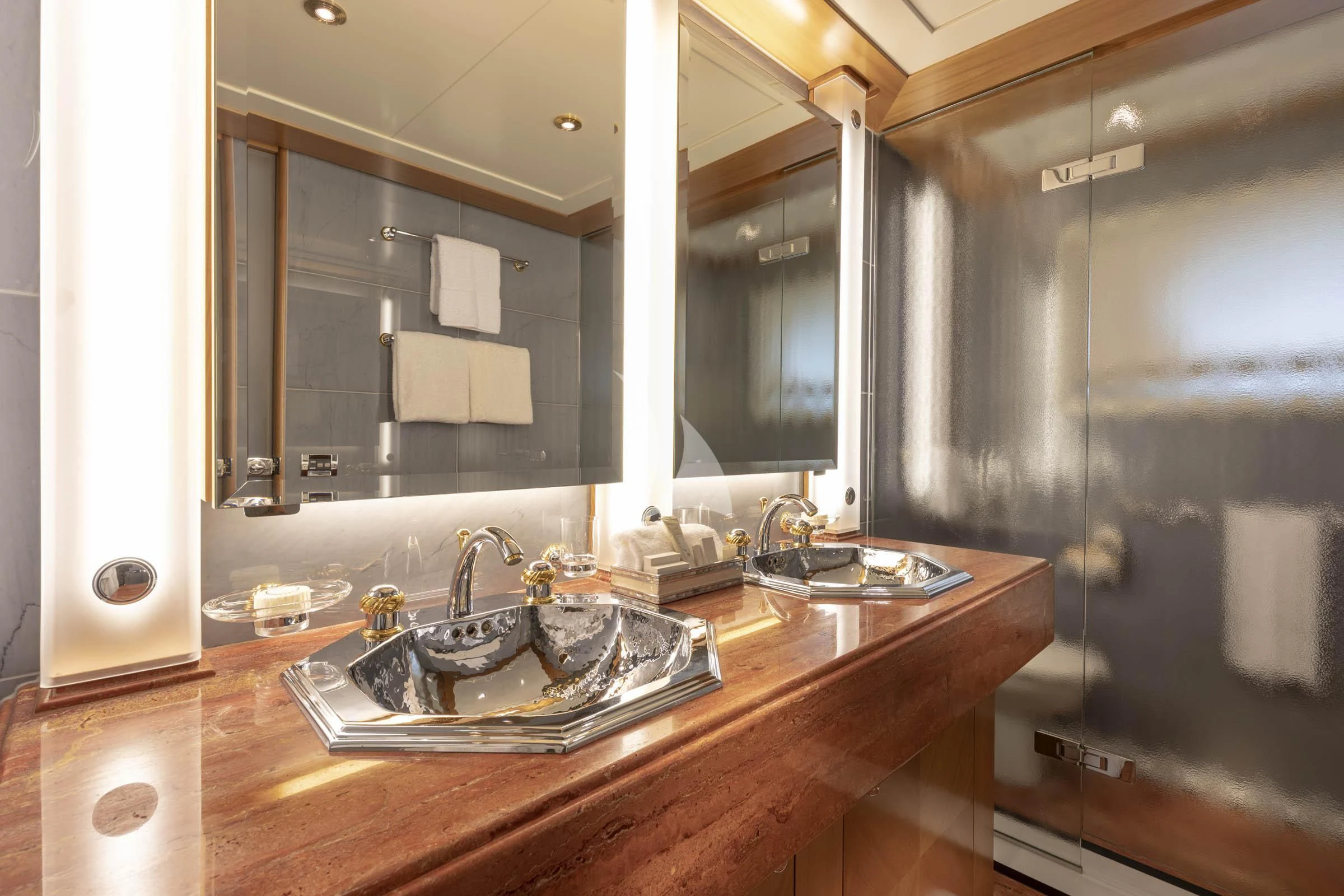 a bathroom with a sink and a mirror aboard VIBRANCE Yacht for Sale