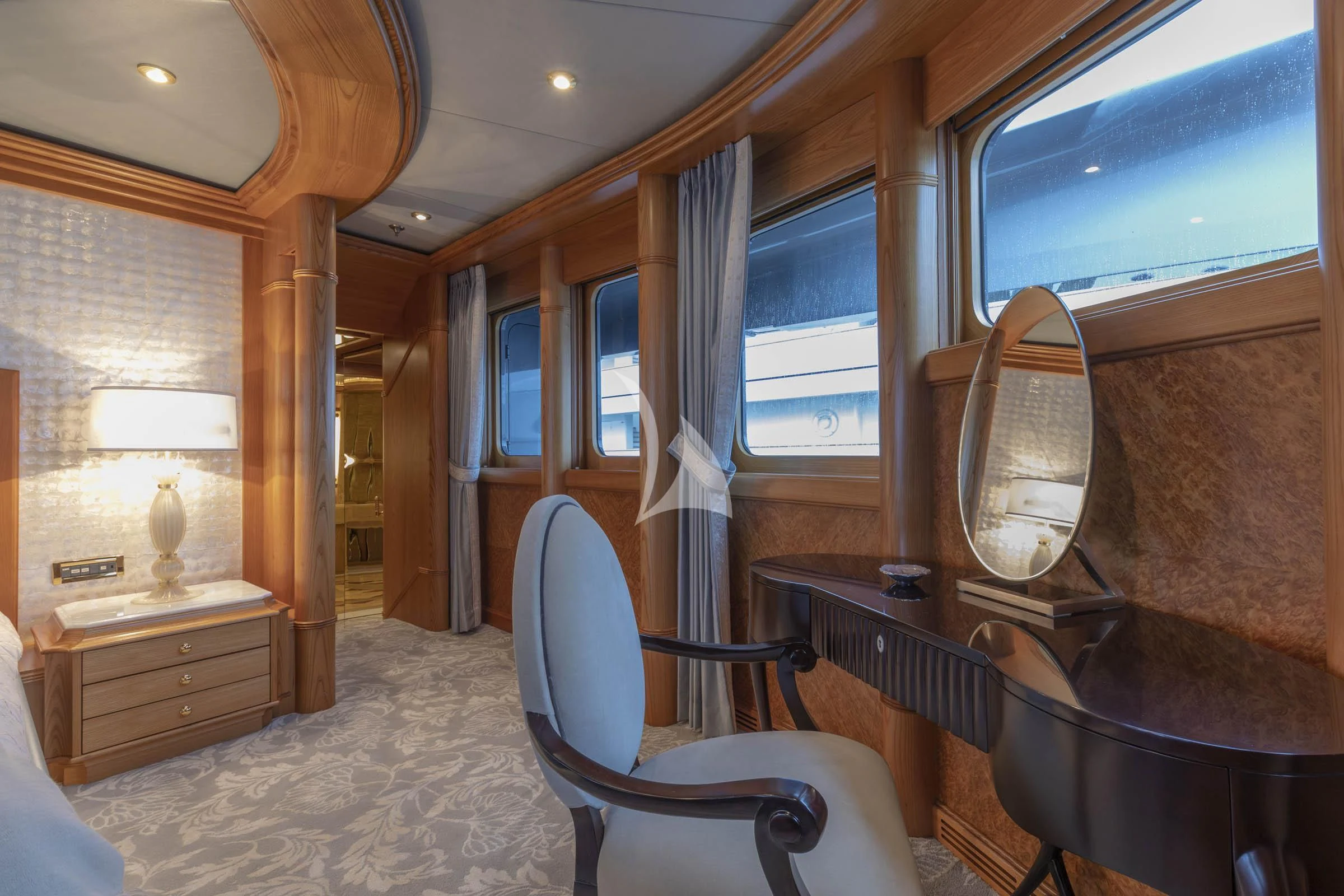 a room with a chair and a table aboard VIBRANCE Yacht for Sale