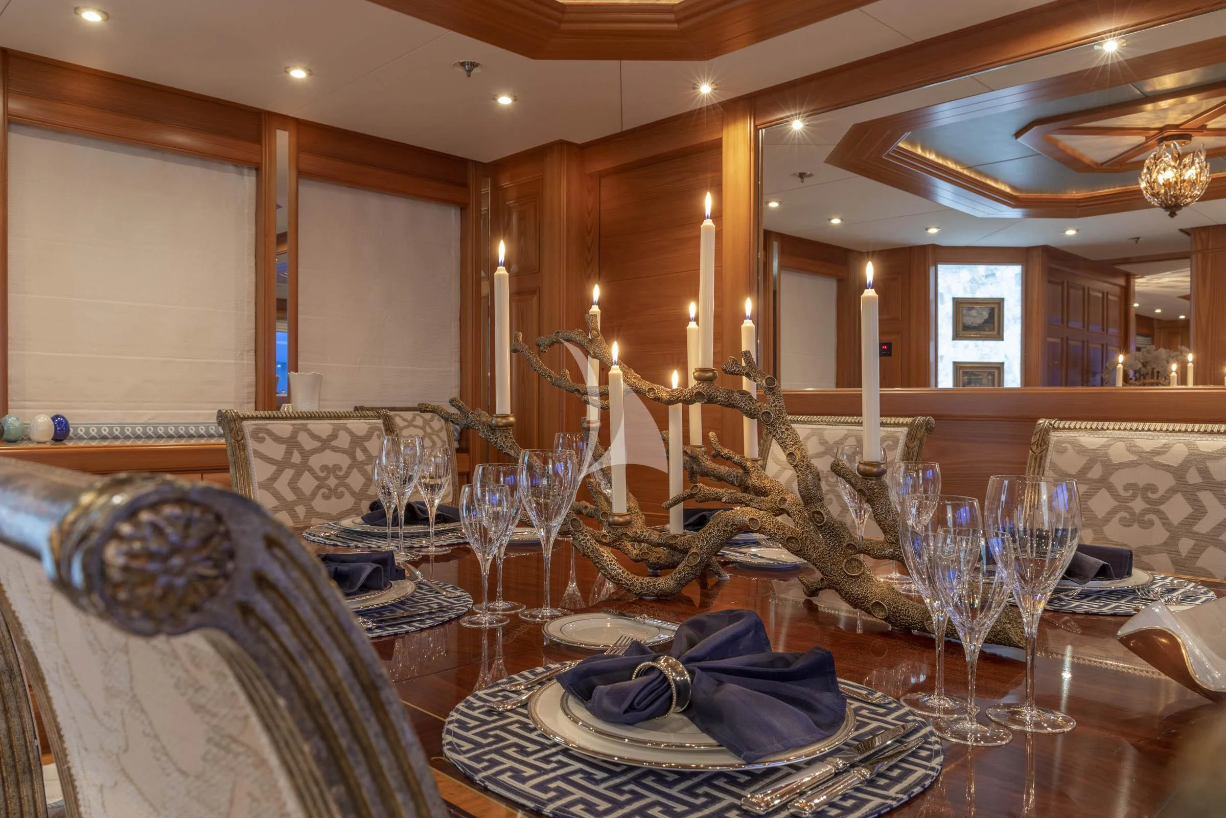 a dining room with a table and chairs aboard VIBRANCE Yacht for Sale