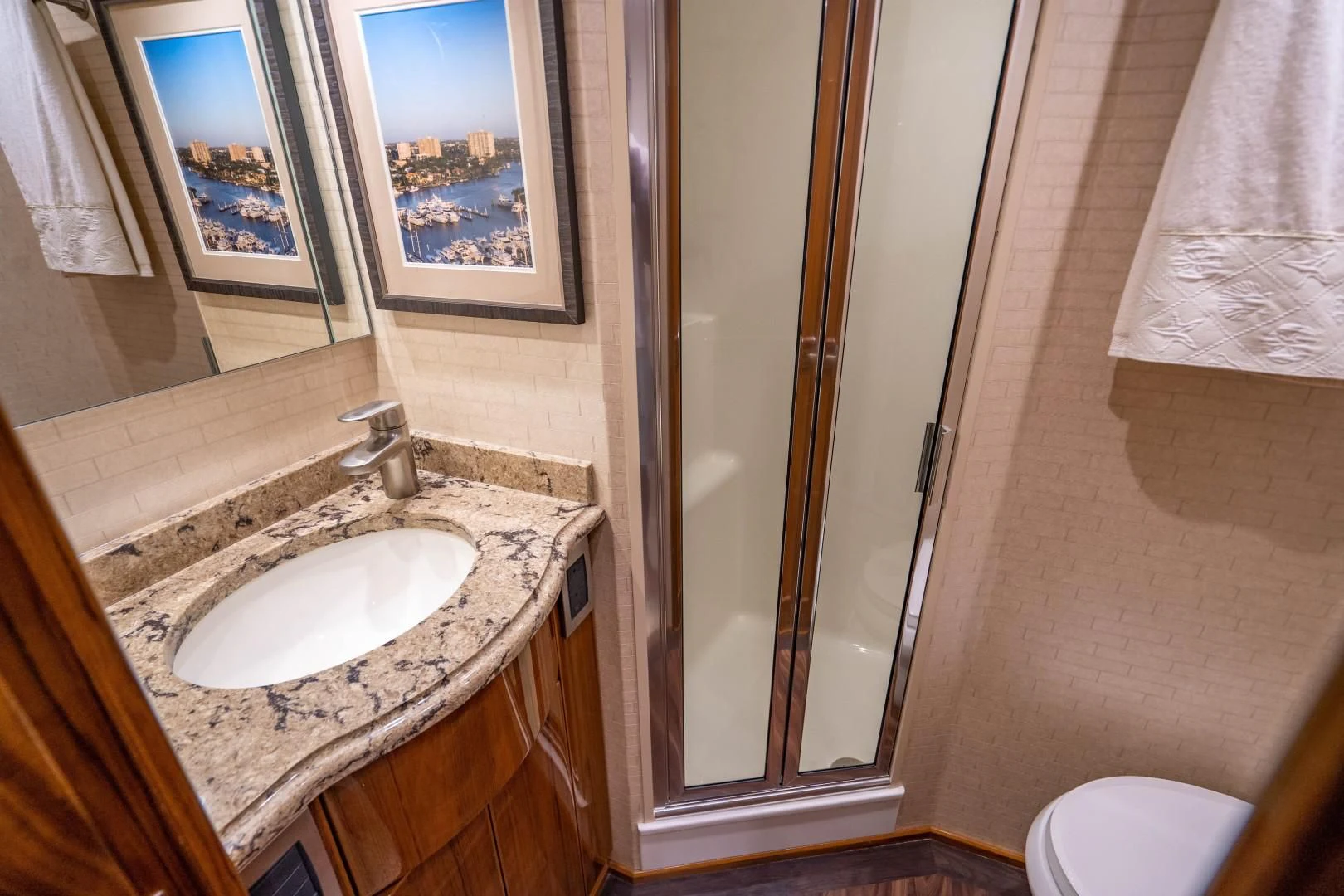 a bathroom with a sink and a shower aboard PLAN B Yacht for Sale