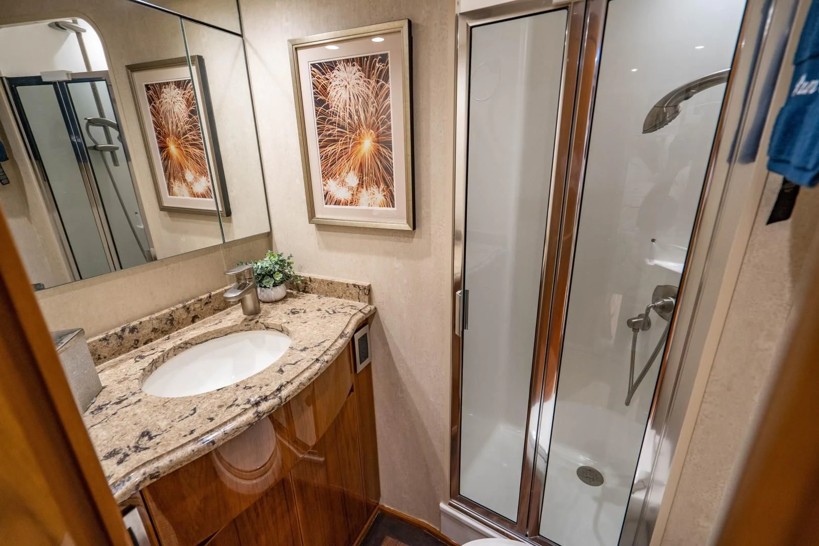 a bathroom with a sink and a shower aboard PLAN B Yacht for Sale