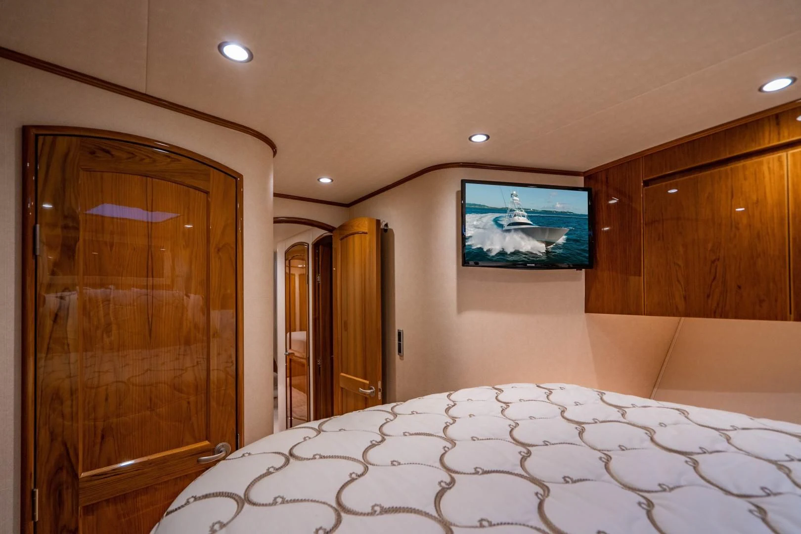a large room with a tv on the wall aboard PLAN B Yacht for Sale