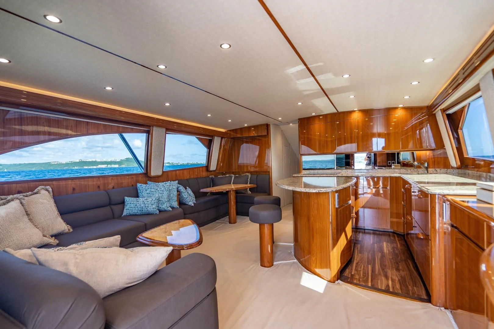 a living room with a large window aboard PLAN B Yacht for Sale