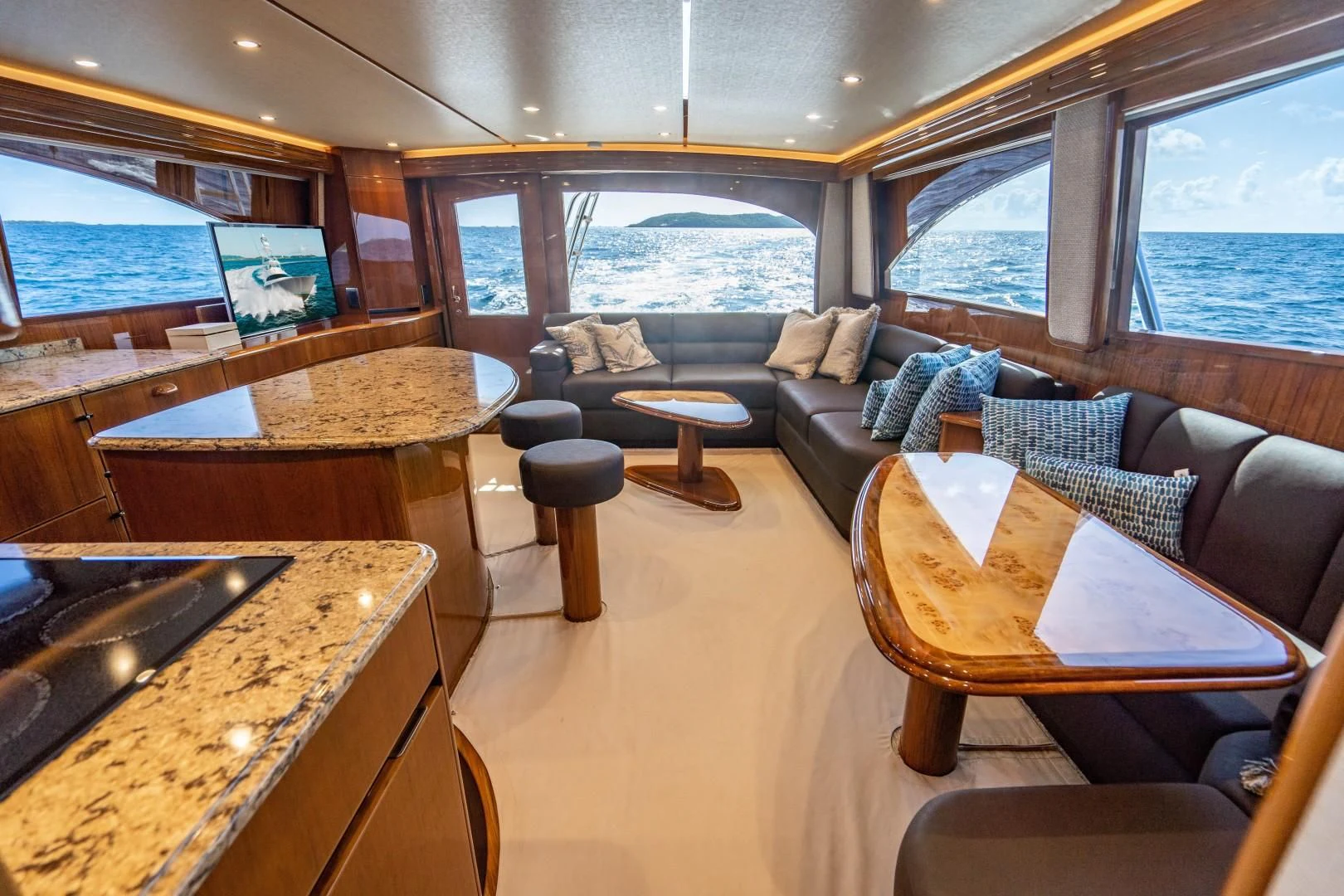 a living room with a large window aboard PLAN B Yacht for Sale