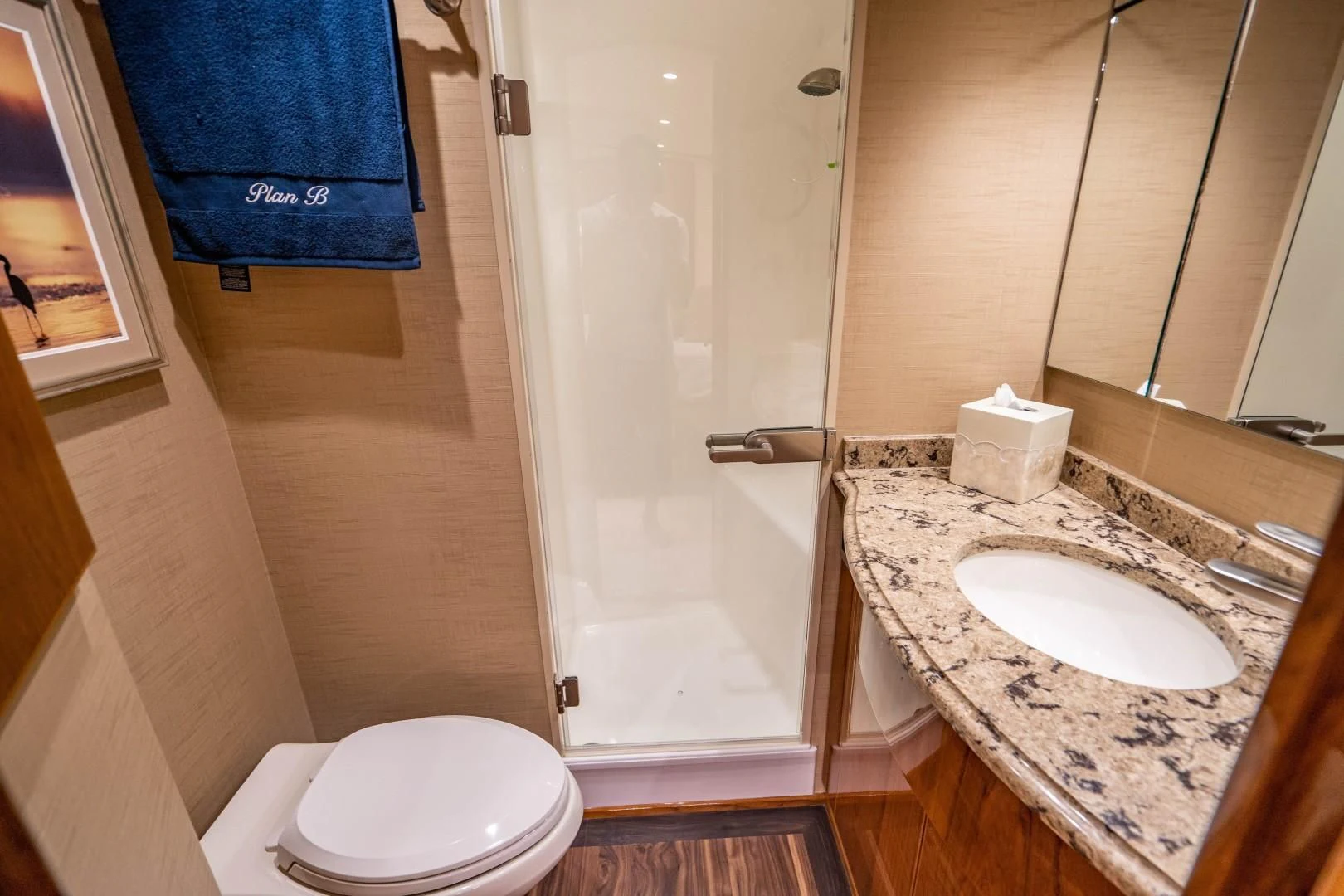 a bathroom with a sink and a shower aboard PLAN B Yacht for Sale