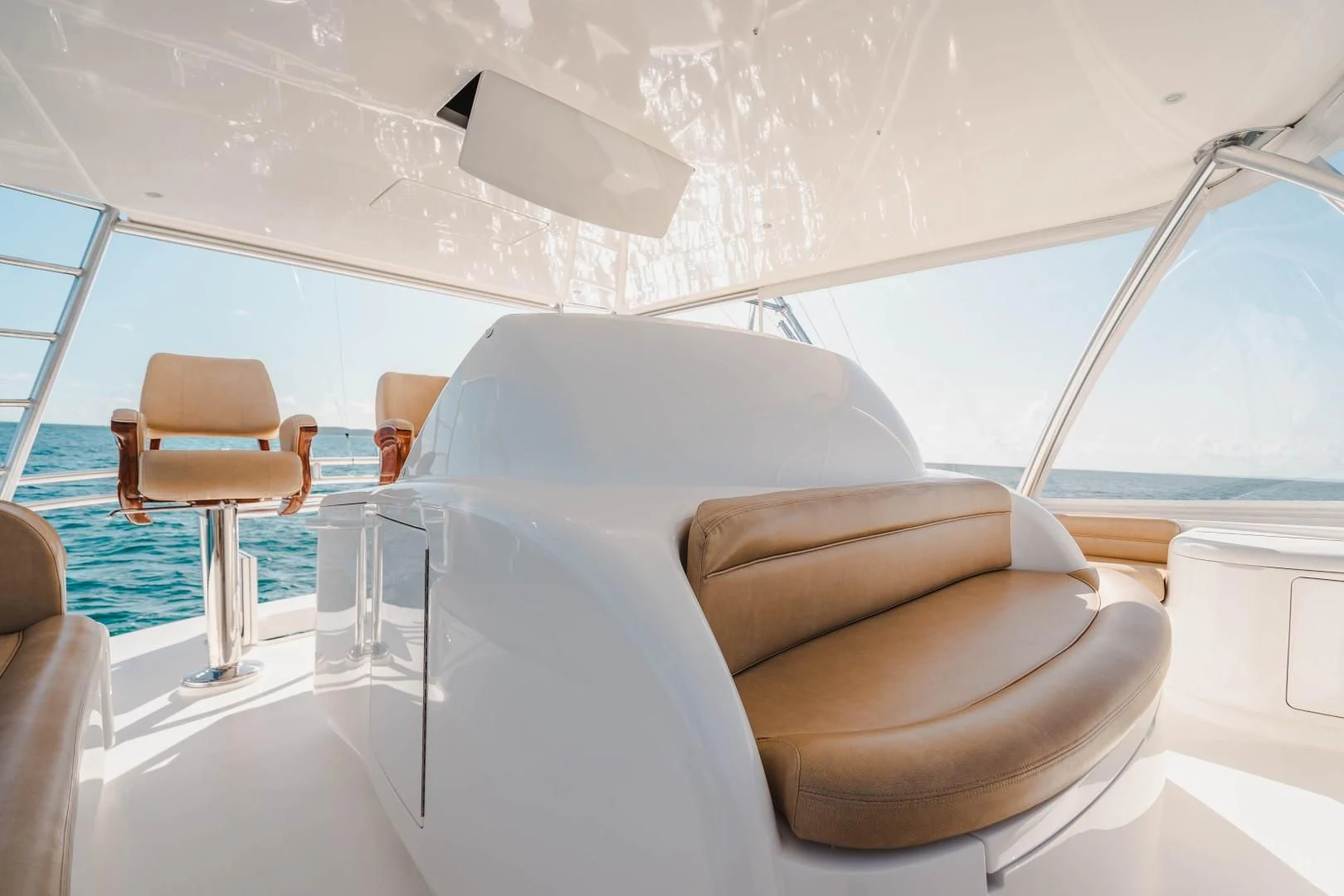 a room with chairs and a table aboard PLAN B Yacht for Sale