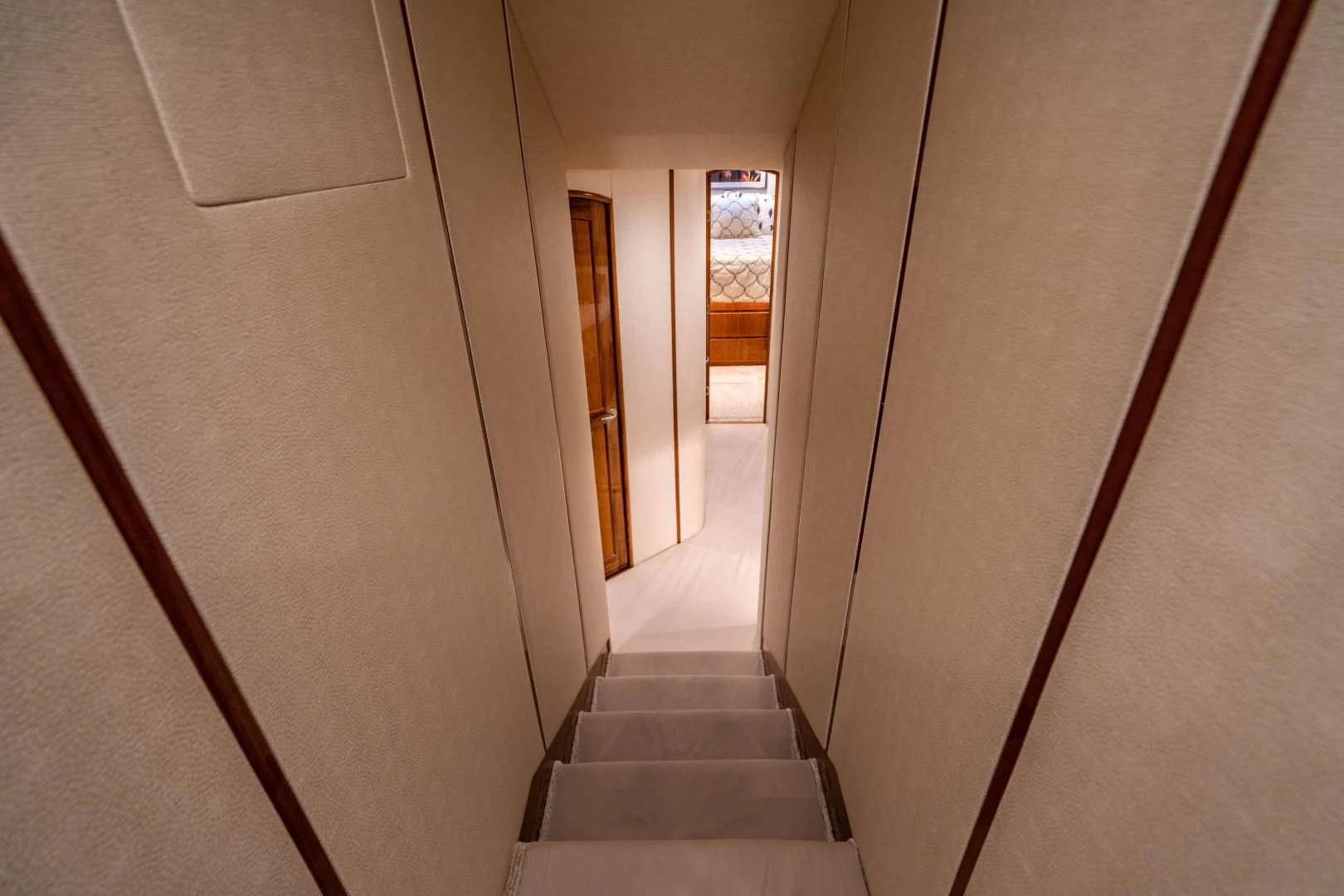a hallway with white walls aboard PLAN B Yacht for Sale