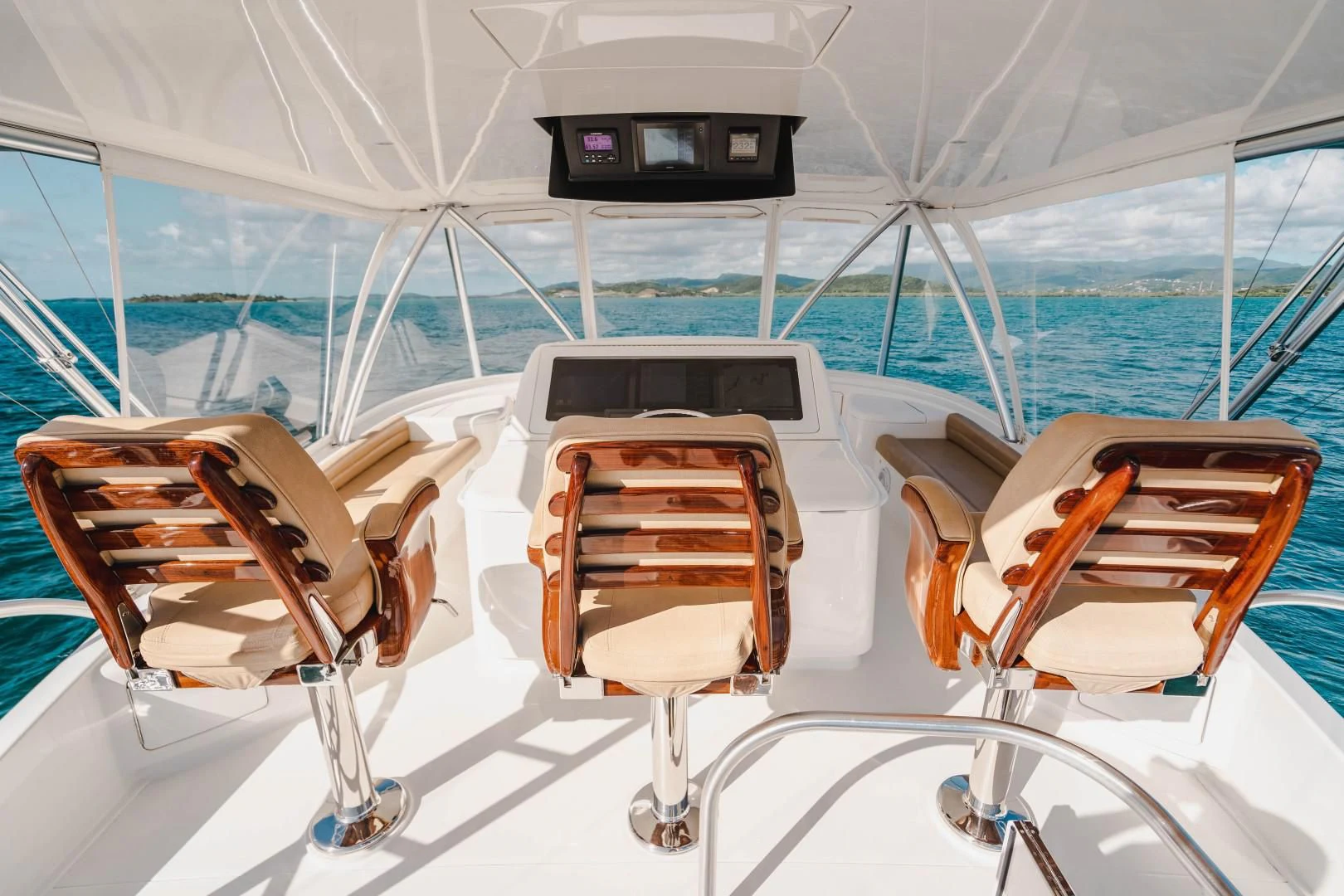 a boat with chairs on the deck aboard PLAN B Yacht for Sale