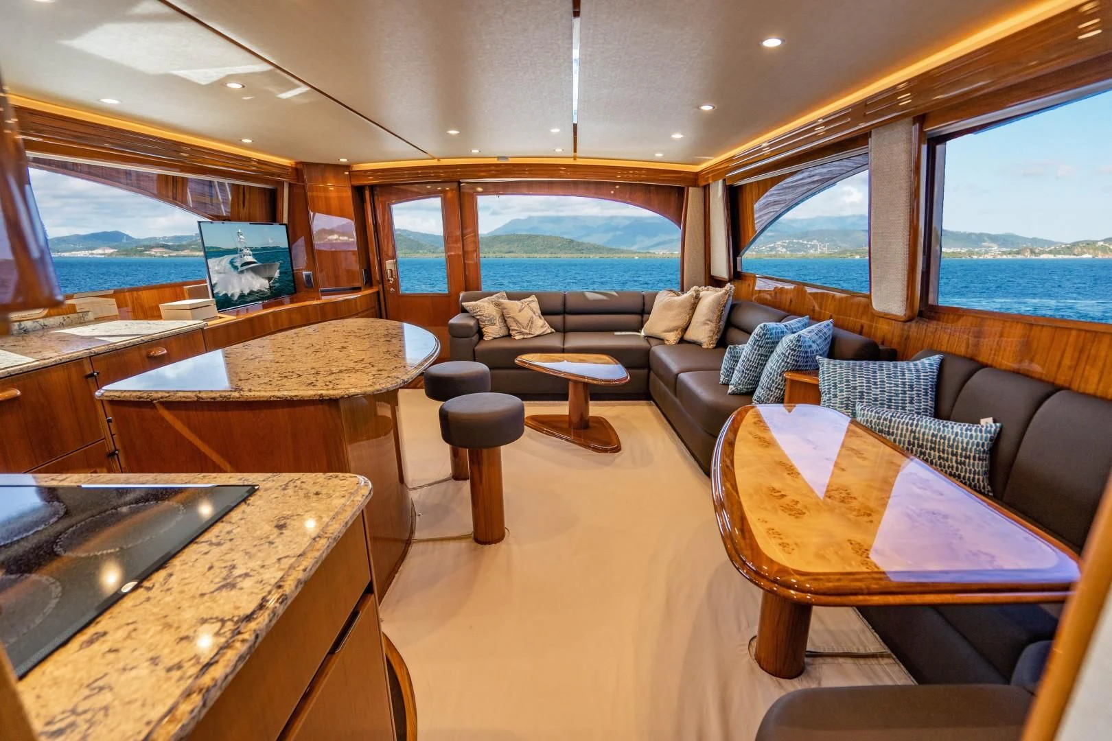 a living room with a large window aboard PLAN B Yacht for Sale