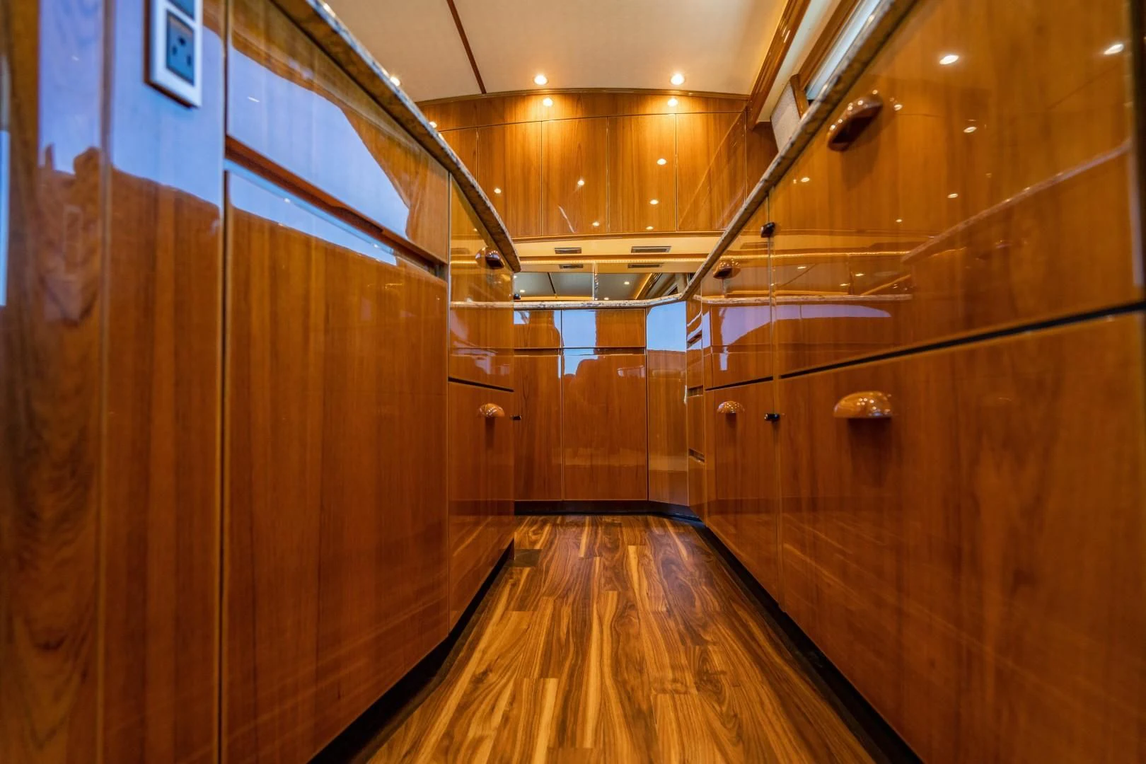 a wood room with wood floors aboard PLAN B Yacht for Sale