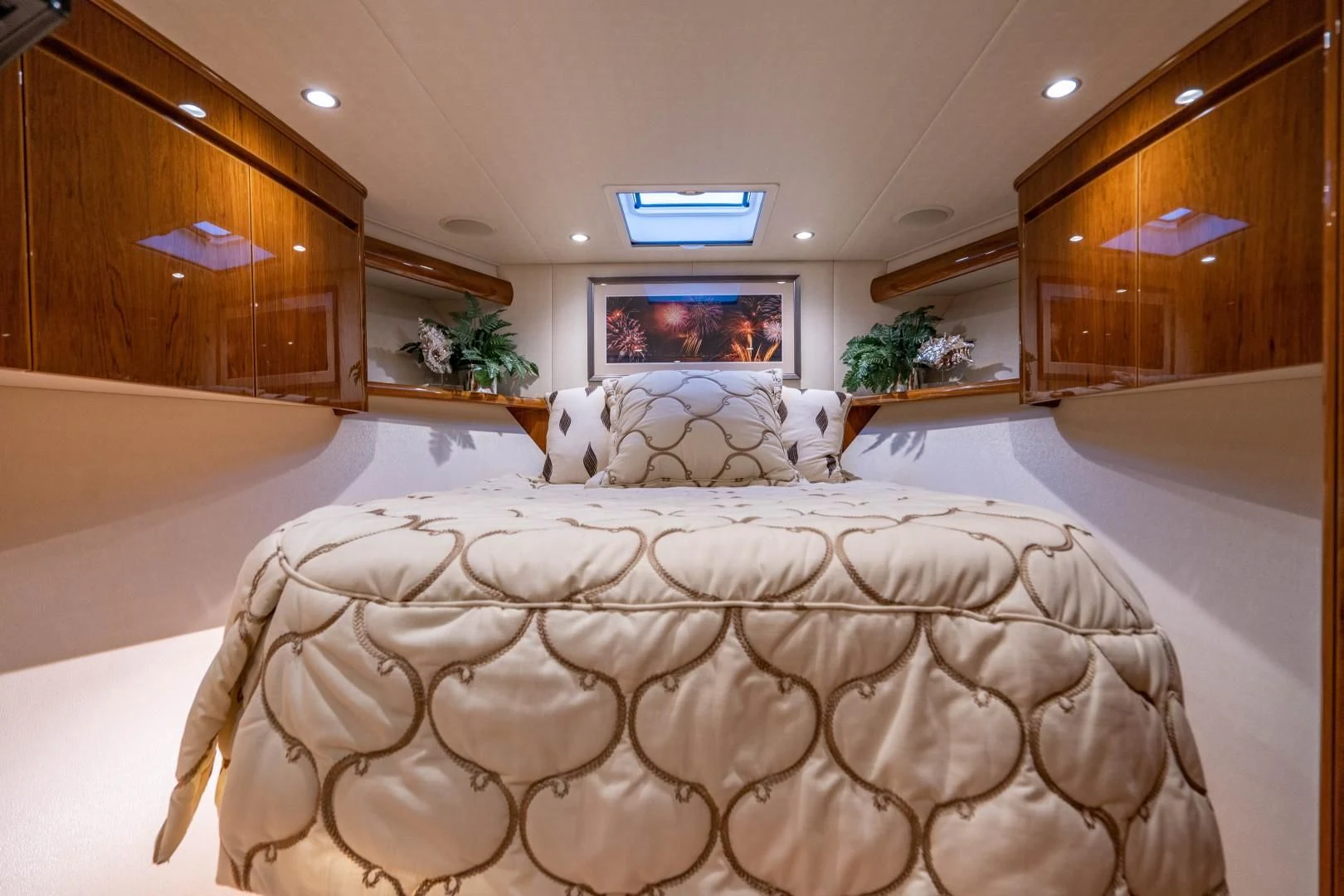 a large bed with white sheets aboard PLAN B Yacht for Sale