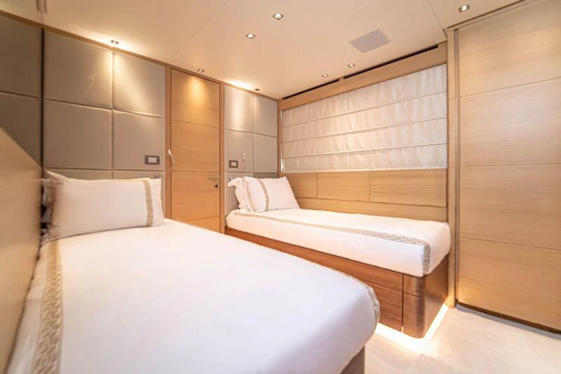 a room with a bed and a closet aboard SOUTH SEA Yacht for Sale