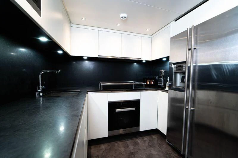 a kitchen with stainless steel appliances aboard SOUTH SEA Yacht for Sale