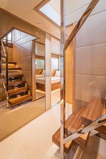 a room with a staircase and a glass door aboard SOUTH SEA Yacht for Sale