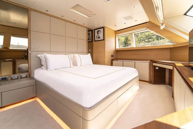 a room with a bed and a window aboard SOUTH SEA Yacht for Sale