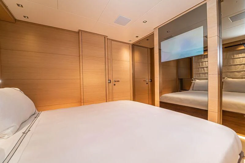 a room with a bed and a television aboard SOUTH SEA Yacht for Sale