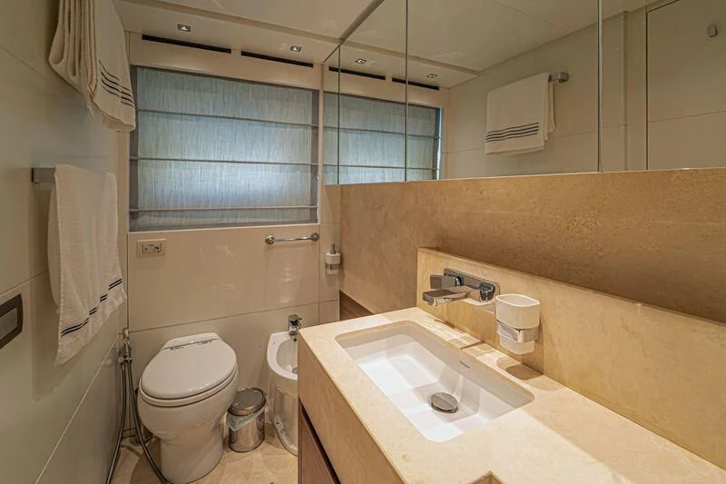 a bathroom with a sink toilet and a bathtub aboard SOUTH SEA Yacht for Sale