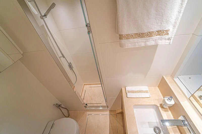 a bathroom with a sink and a toilet aboard SOUTH SEA Yacht for Sale