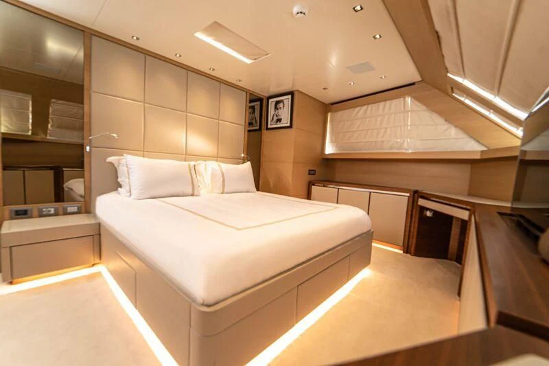 a room with a bed and a desk aboard SOUTH SEA Yacht for Sale