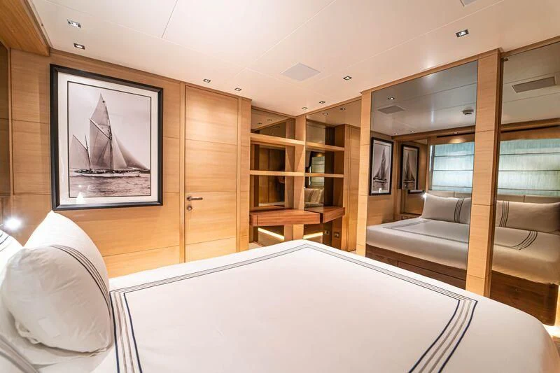 a room with a bed and a desk aboard SOUTH SEA Yacht for Sale