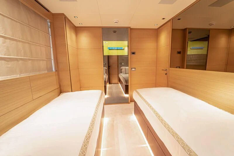 a room with a bed and a desk aboard SOUTH SEA Yacht for Sale
